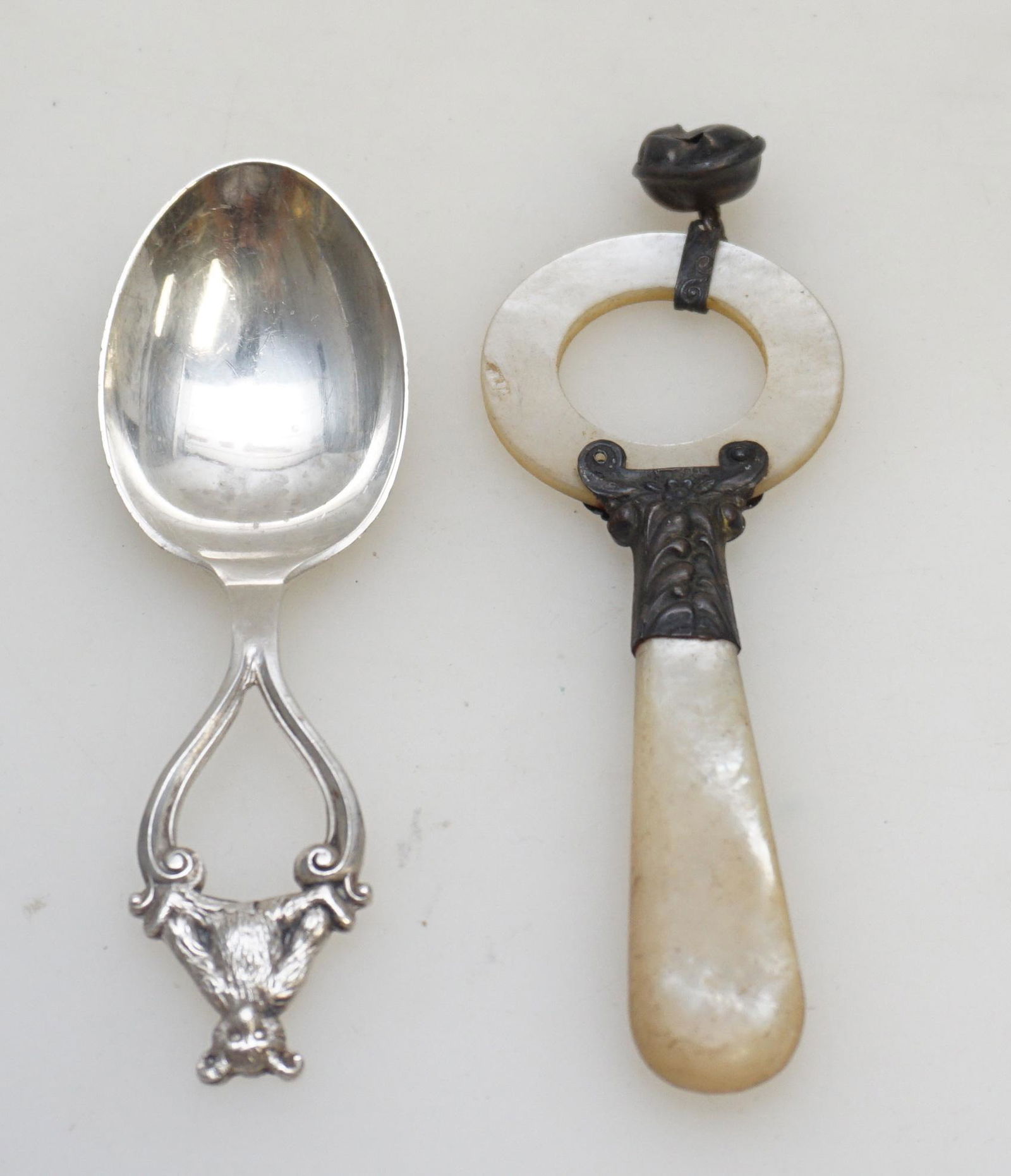 STERLING BABY SPOON & RATTLE: Lunt Silversmiths SterSilver Teddy Bear Baby Spoon 3 1/4". MOP and Silver Antique Baby Rattle 3 3/4". Weight on all 1.5 oz. PROVENANCE: A Private Charleston SC Estate.