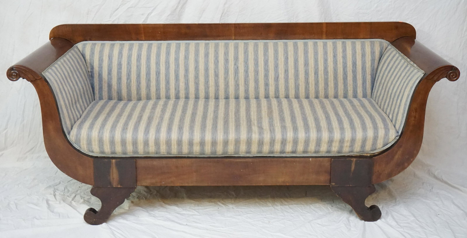 19th c BIEDEMEIER SOFA - VIENNA: Antique 19th c. Biedemeier Sofa from Vienna. The legs end with volutes. Moreover, the armrests are characteristically rolled outward. Covered in a blue/gray and cream upholstery. Purchased in Vienna. 