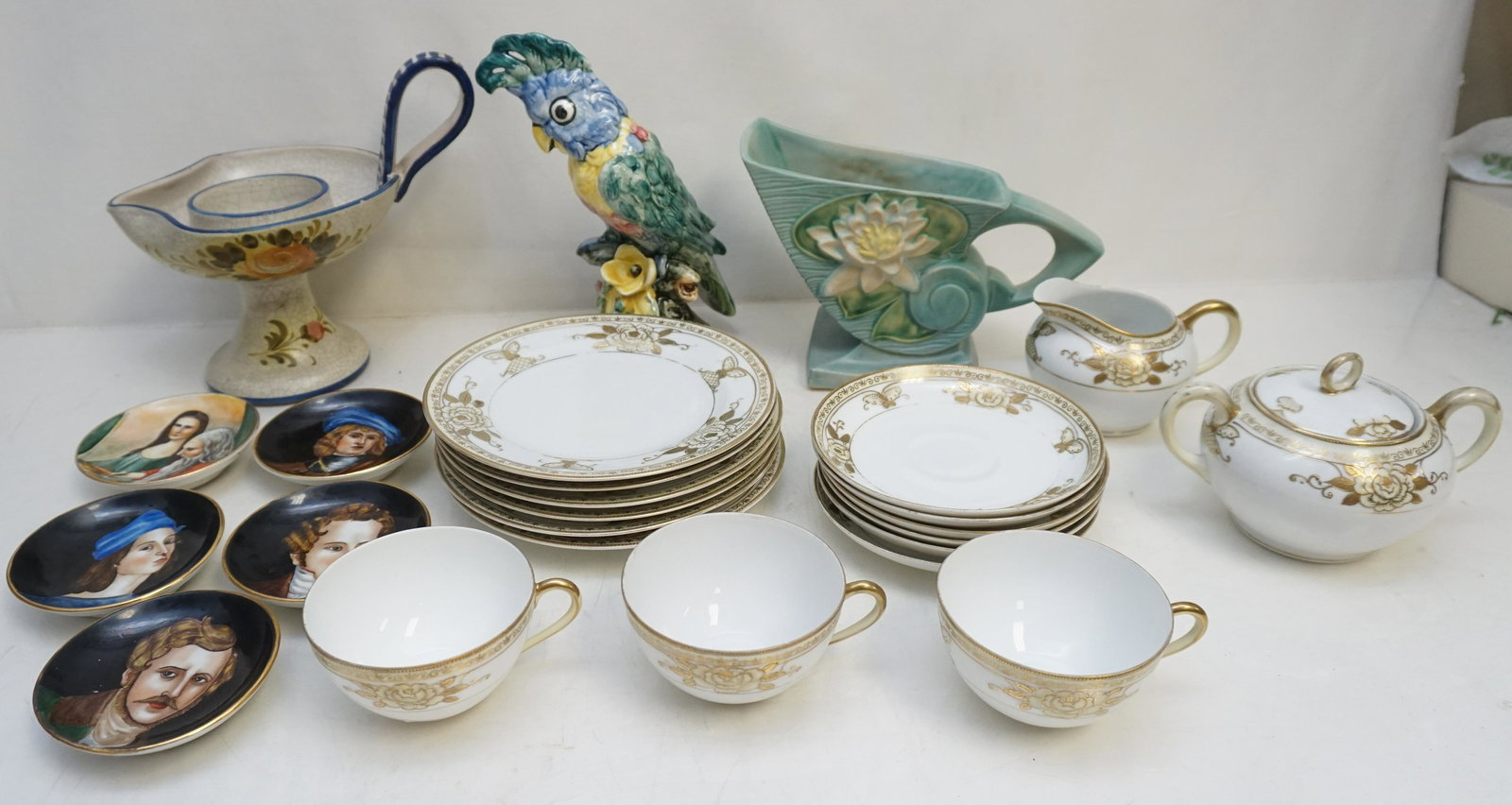 BOX LOT ROSEVILLE - STANGL - ITALY +: 1- 6 Meito China Hand Painted Butterfly & Flowers Salad / Dessert Plates 7 1/2", 6 Saucers 6", 3 Teacups, Cream and Sugar. 2- Vintage Stangl Parrot 9 1/4". 3- 5 Hand Painted Firenze Italy Famous Artis