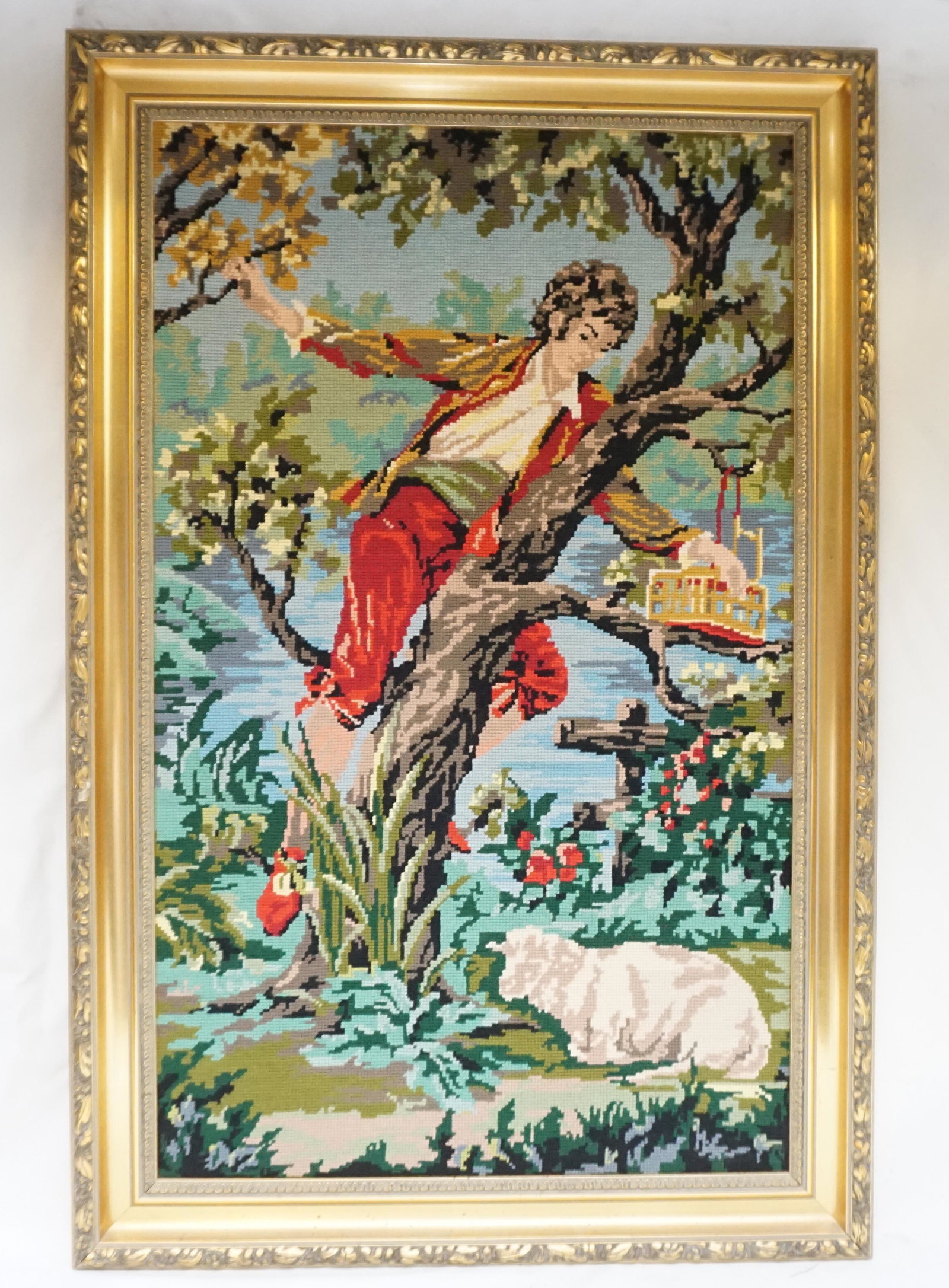 VINTAGE FRAMED WOOL NEEDLEPOINT c. 1940s: Vintage Continental c. 1940s Wool Needlepoint, Man in tree. In attractive gilt wood frame. In frame 21.5" x 32.5 ( stretcher 17' x 28.5) Depth 1.5". Weight 7 pds.