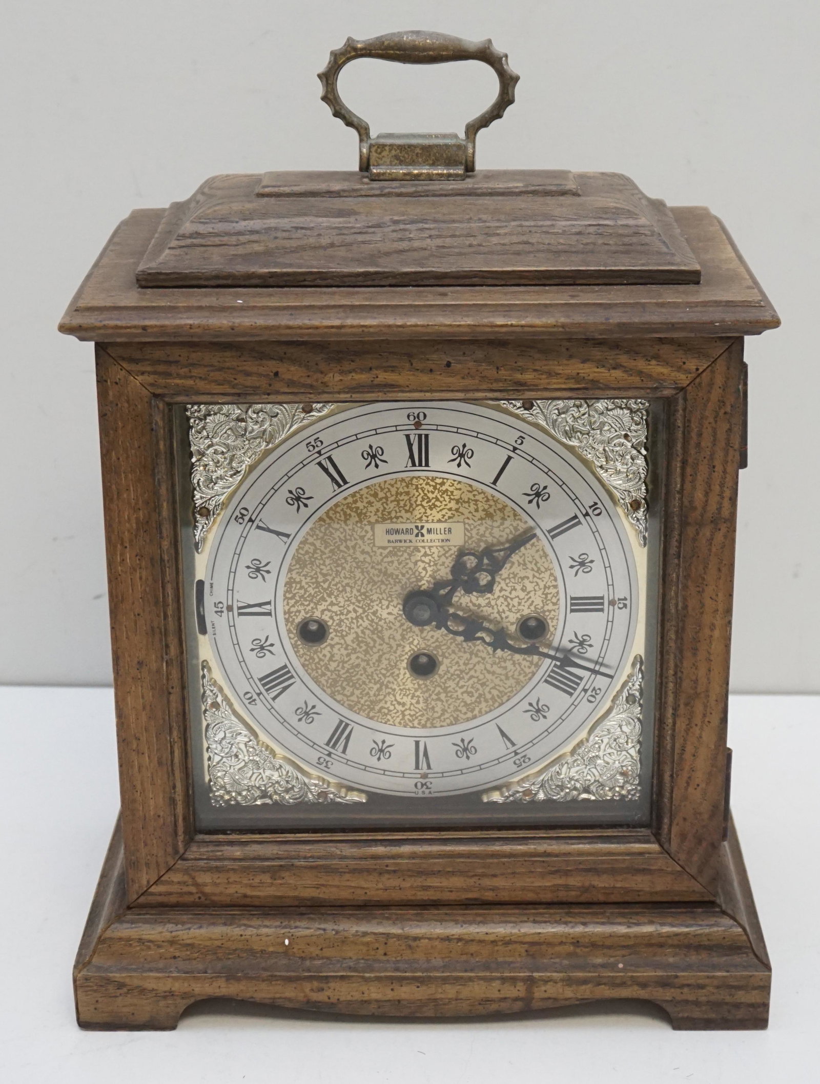 HOWARD MILLER BARWICK CLOCK: Vintage Howard Miller Barwick Collection Mantle Clock. Triple Chime, includes Key and paperwork. Not running, untested. Measures 10"x6 1/4"x14". Weight 8 pds 10 oz. PROVENANCE: The Estate of Dr. Frase