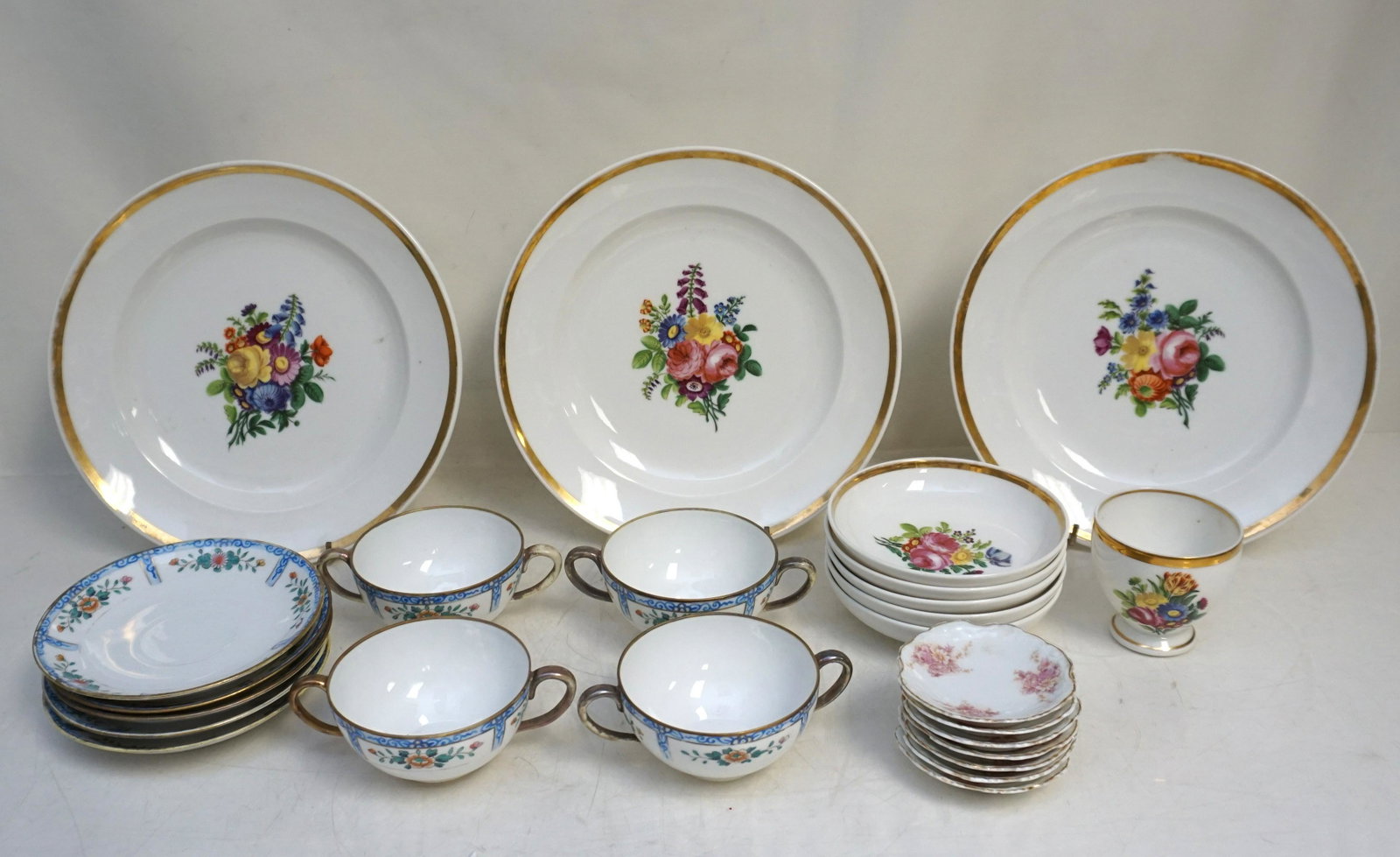 25 PC VARIOUS CHINA - NIPPON - GERMAN: 1- 7 Antique Porcelain Butter Pats each 3". 2- 3 German Hand Painted Dinner Plates, unmarked 9 1/2", 5 Fruit Bowls 5", 1 Teacuop 2 3/4. 3- Vintage Nippon Hand Painted 5 Saucers and 4 Cream Soup Bowls 