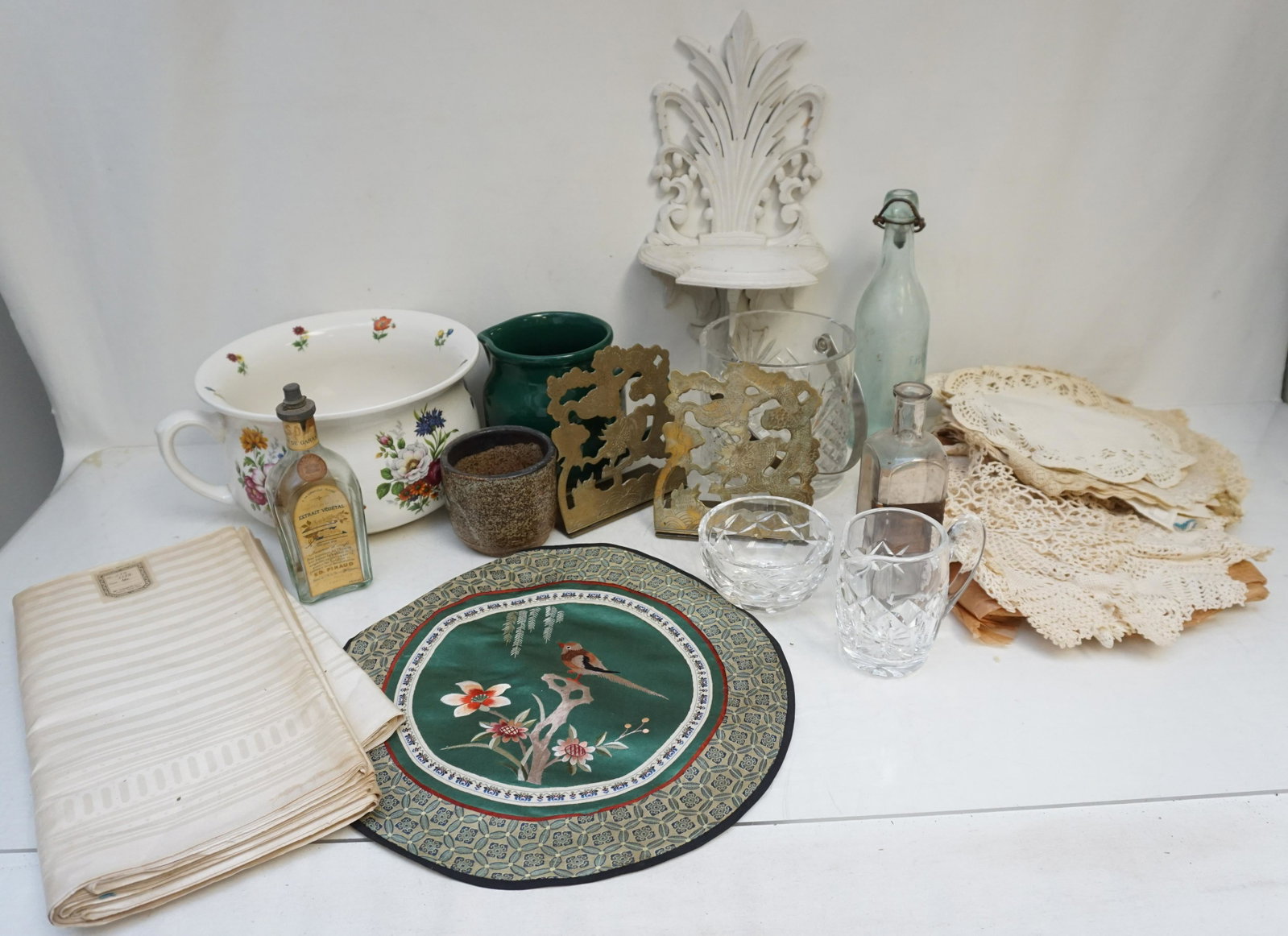 DEALER BOX LOT POTTERY - GLASS+: Large Dealer Box Lot. .Includes an Antique Arthur Wood Chamberpot. Group of B. Altman Linens. Crystal Ice Bucket, Creamer and Bowl. Wachterbach Spain Green Jug.. Vintage Folding White Wood Wall Shelf 