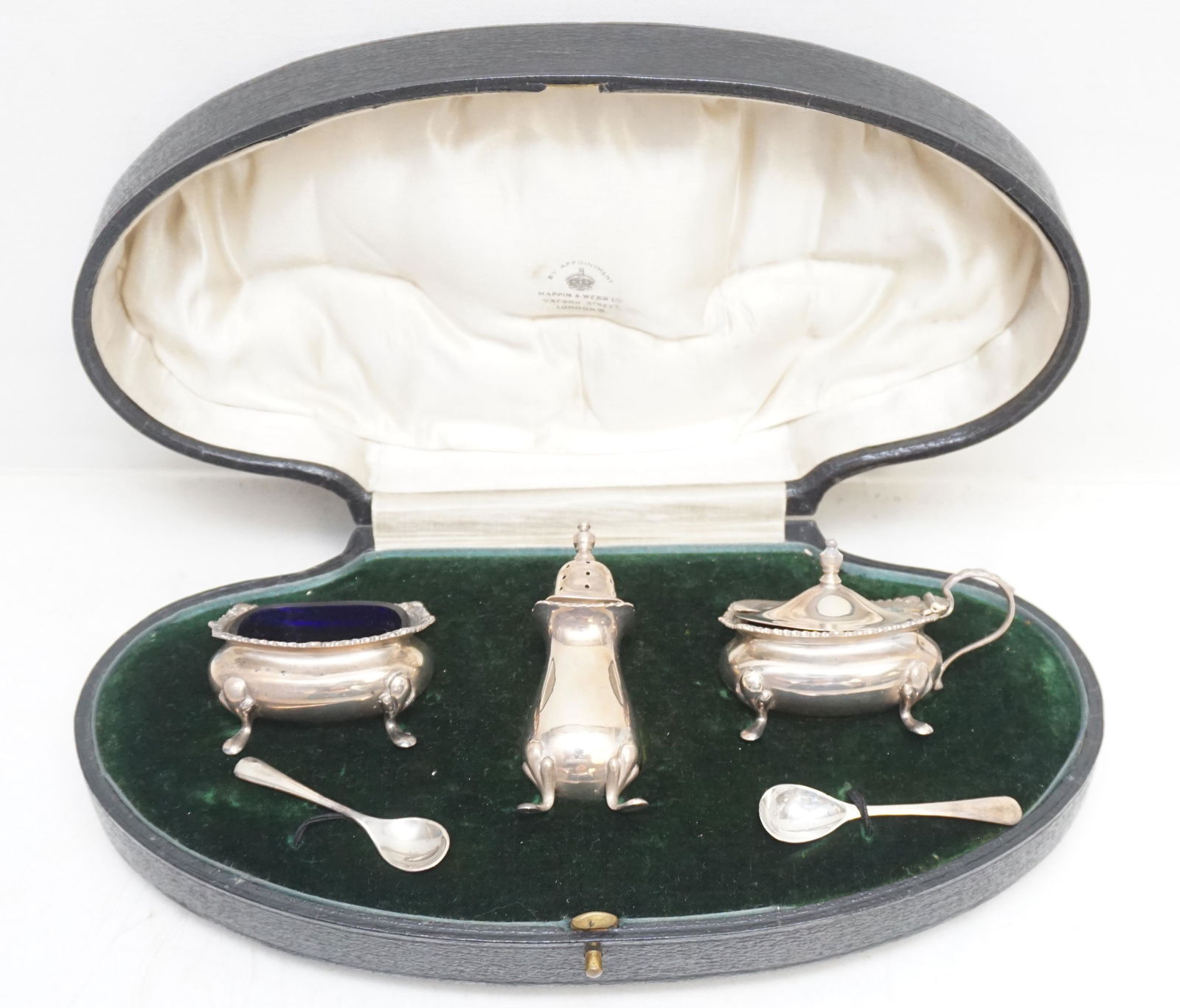 ENGLISH STERLING BOXED CONDIMENT SET: Mappin & Webb, Birmingham hallmarked sterling condiment set in original satin lined presentation box. Five pieces are included in this set - shaker, salt cellar, covered mustard pot and 2 spoons (plus