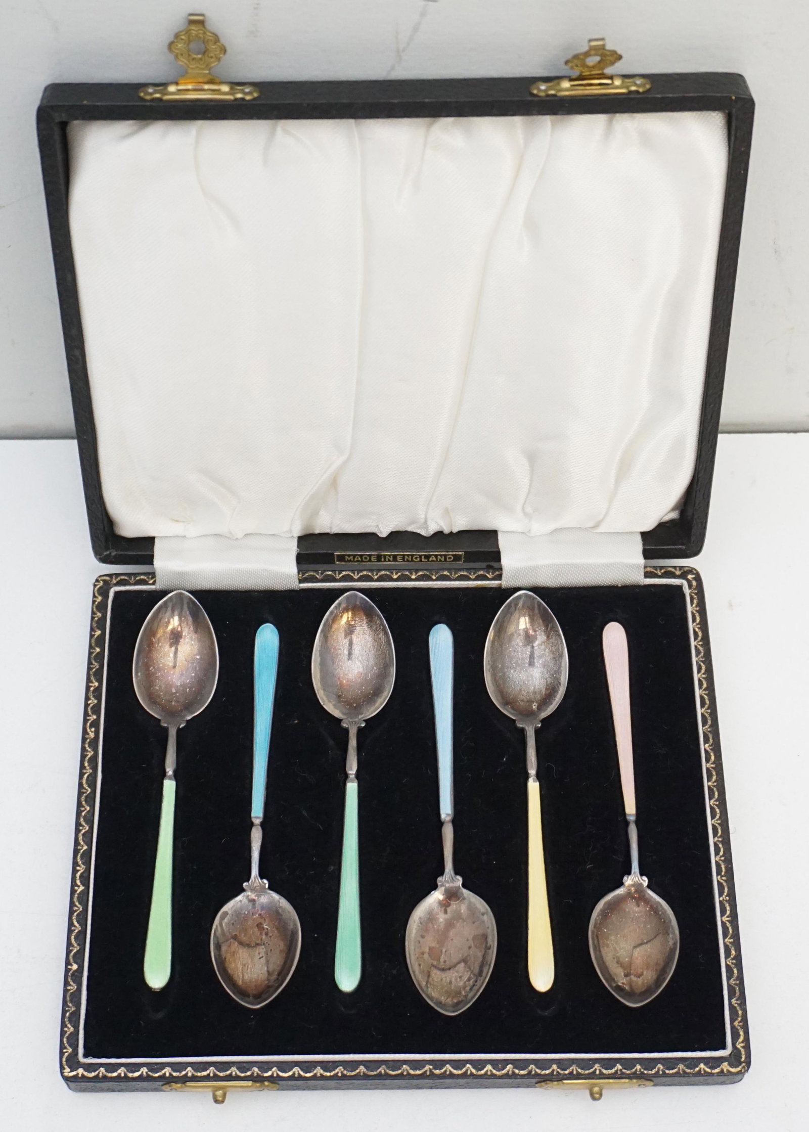 ENGLISH STERLING ENAMELED DEMITASSE SPOONS: English sterling silver set of 6 demitasse spoons with guilloche enameled handles and backs of the bowls, made by Henry Clifford Davis, Birmingham 1932. In the original Presentation Box. 6"x5"x1". Eac