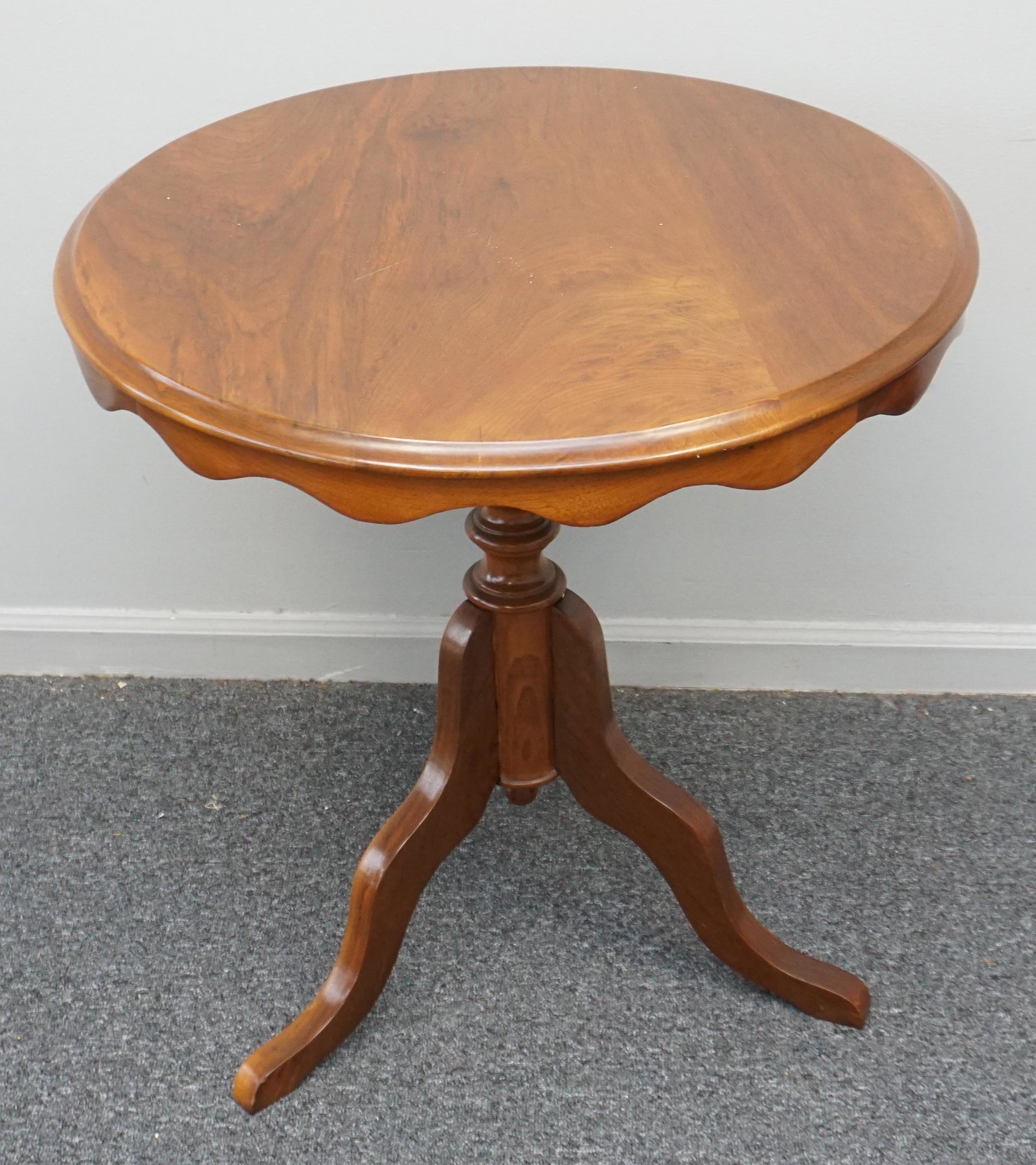 CHERRY SCALLOPED TABLE: Vintage Round Solid Cherry Occasional Table with scalloped skirt. Nicely turned pedestal base. Measures 27 1/2"x27 1/2"x27 1/2". PROVENANCE: A Private Charleston SC Estate. ***Pickup only or Shipping 