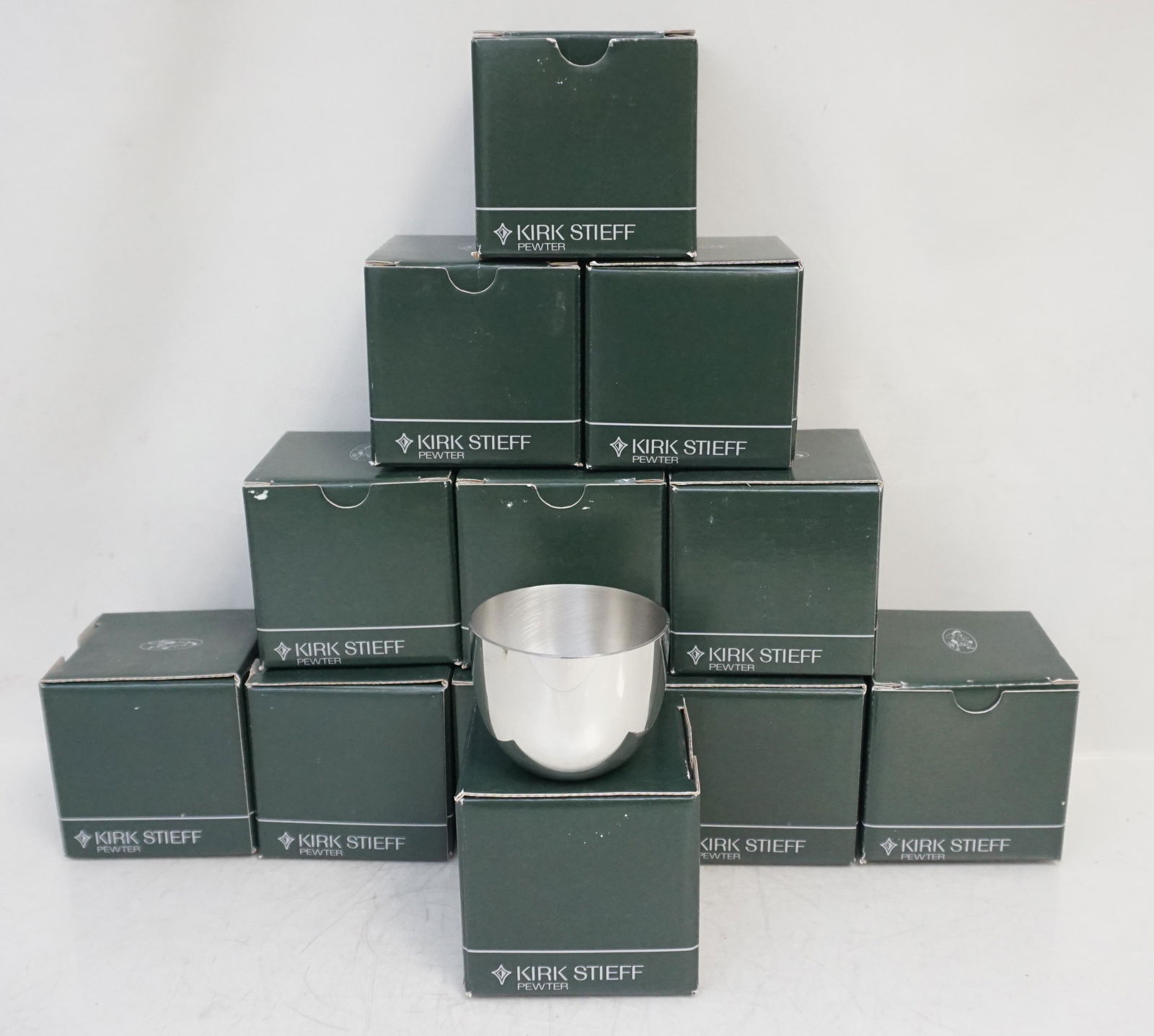 12 KIRK STIEFF PEWTER JEFFERSON CUPS: 12 Kirk Stieff Pewter Jefferson Cups in the original boxes. Never used. In 1810, when Thomas Jefferson commissioned a silversmith to make eight cups from his own design, he probably never imagined how