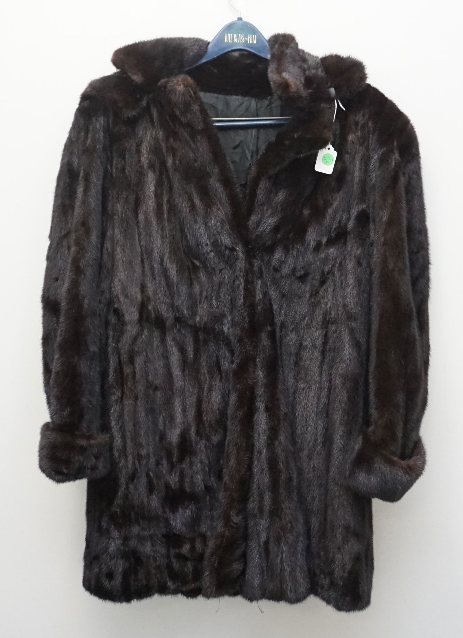 MINK FUR STROLLER COAT WITH HOOD: Black Mink Stroller that has velvet lined slit pockets, three hook & eye clasp closures and a detachable black velvet lined mink hood. It is fully lined with silk. Size appears to be medium 12 to 16.