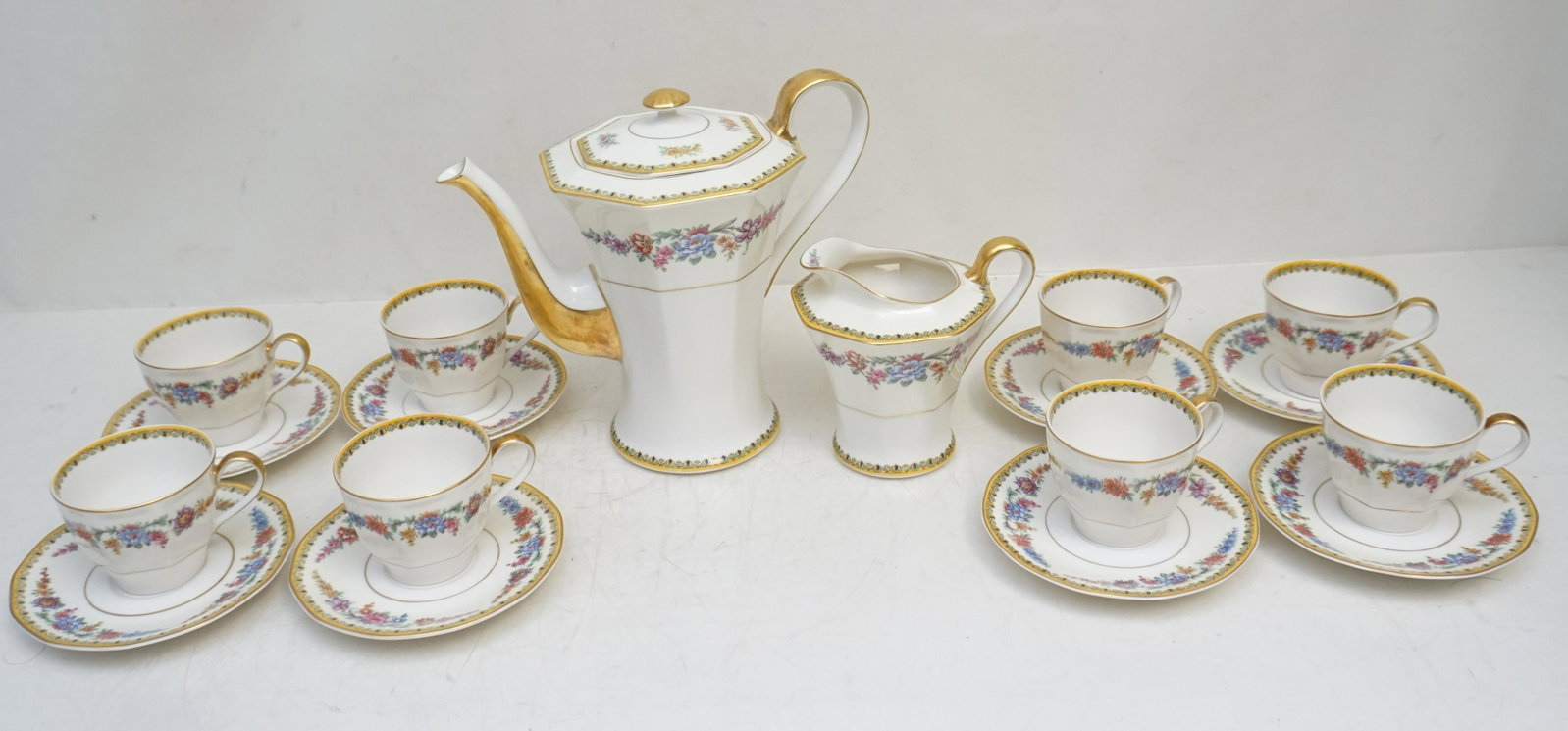 18 PC HAVILAND FRONTENAC COFFEE SERVICE: Theodore Haviland, New York c. 1930 Frontenac Coffee Service. Includes Coffee Pot 7 1/2", Creamer 4 1/4", 8 Demitasse Cups and Saucers. All are in very good condition. Weight on all 5 pds 15 oz. PROVE