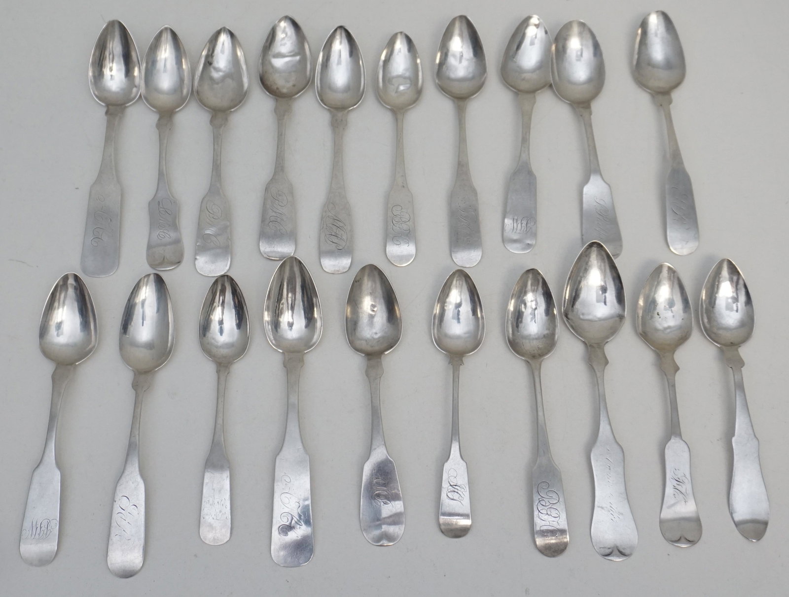 20 AMERICAN COIN SILVER TEASPOONS: 20 Antique 18th and 19th c. American Coin Silver Teaspoons. Makers include Henry Evans, T.J. Megear, Hedges, Lander, F.L.A., Z. Elliot, W.C. Defriez, J.M. Barrows, N.S. & Co., W.O. Loomis, W.T. Rice a