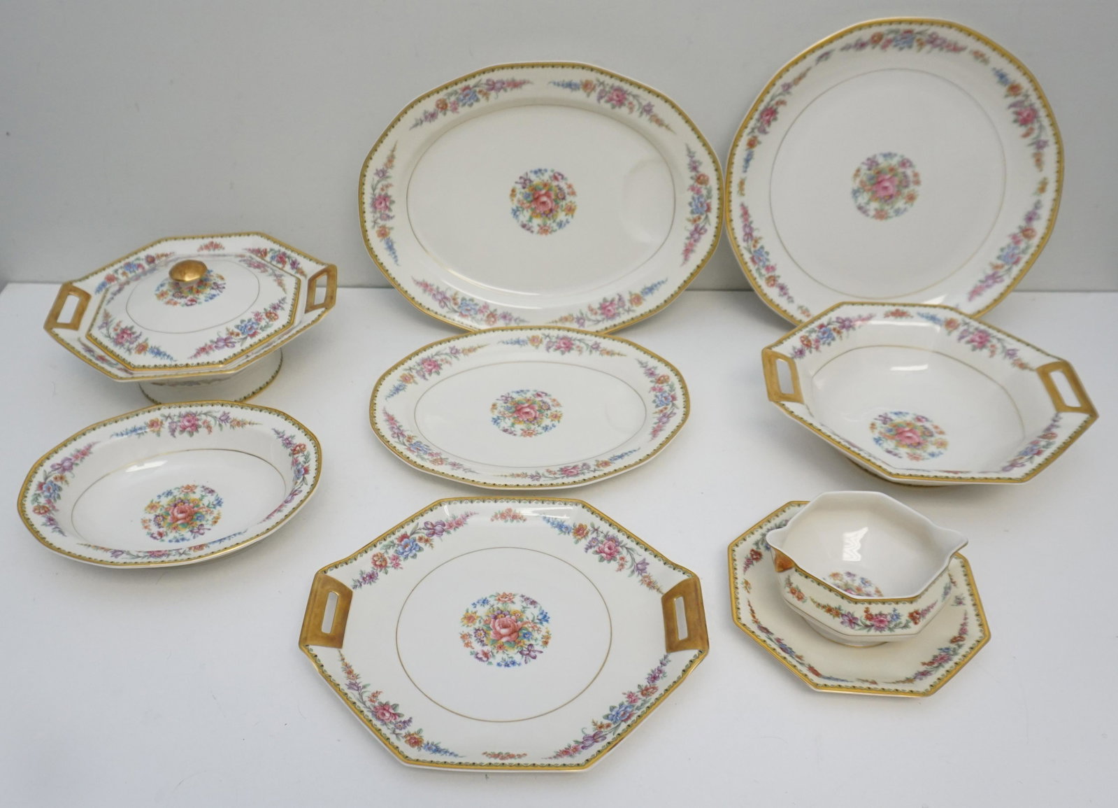 8 PC HAVILAND FRONTENAC SERVING PIECES: Theodore Haviland, New York c. 1930 Frontenac China. 1- Octagonal Covered Vegetable Bowl 10". 2- Large Serving Platter with Well 14". 3- Serving Platter with Well 11 1/2". 4- Round Serving Platter 12 
