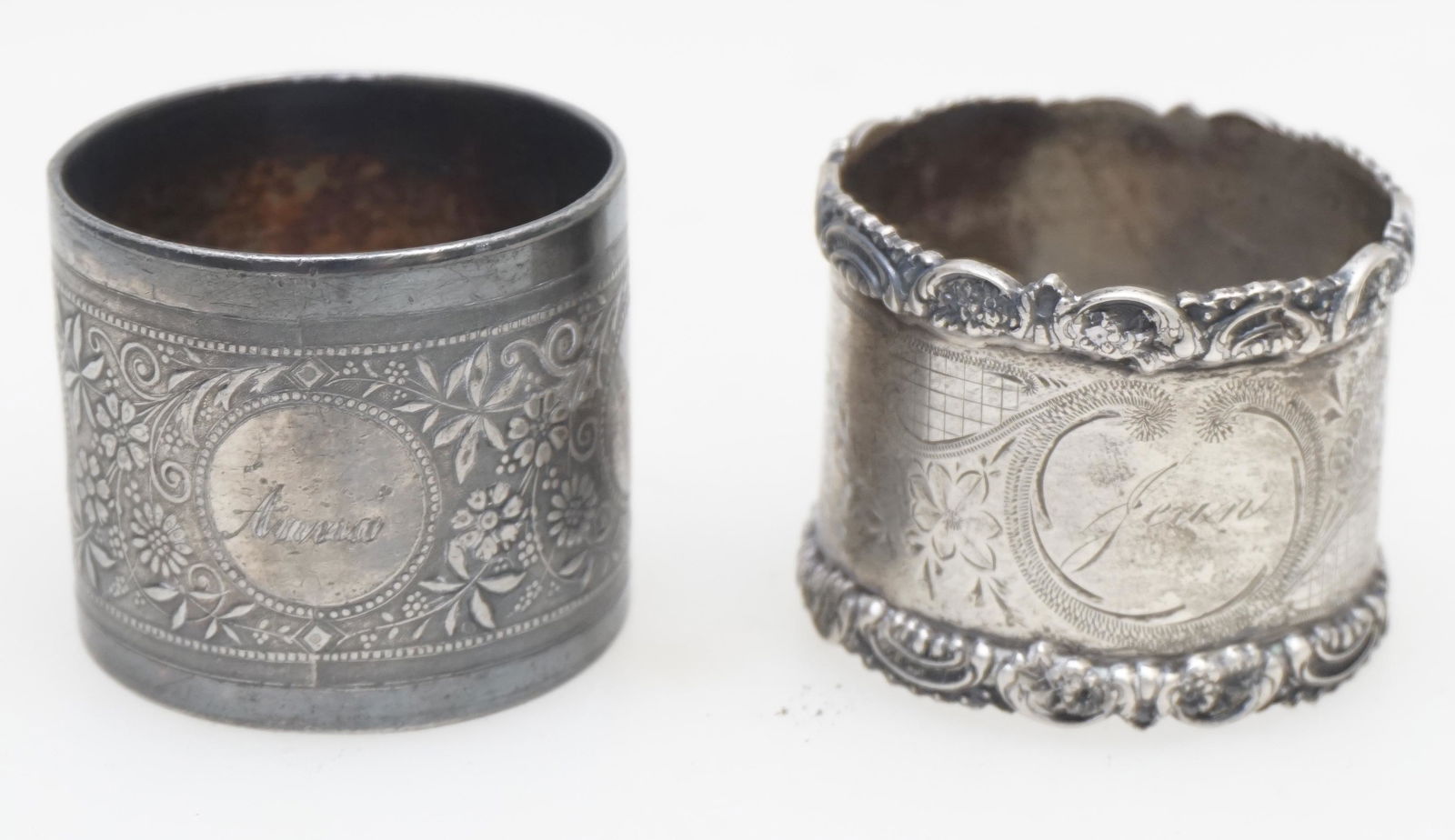 2 VICTORIAN 19th C NAPKIN RINGS: Two Victorian Napkin Rings. Both monogrammed. "Jean" is marked sterling silver 1 1/2" and Anna has no marks 1 1/2". PROVENANCE: A Private Charleston SC Estate.