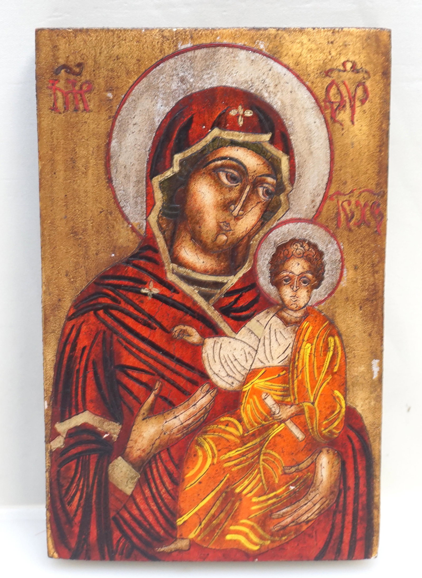 VINTAGE CARVED AND PAINTED GREEK ICON: Vintage Traditional Greek Orthodox Byzantine Madonna and Child, carved and hand painted on wood panel. Measures 5 2/4"x8"x1". Weight 11 oz. PROVENANCE: A NYC / Charleston Private Estate.