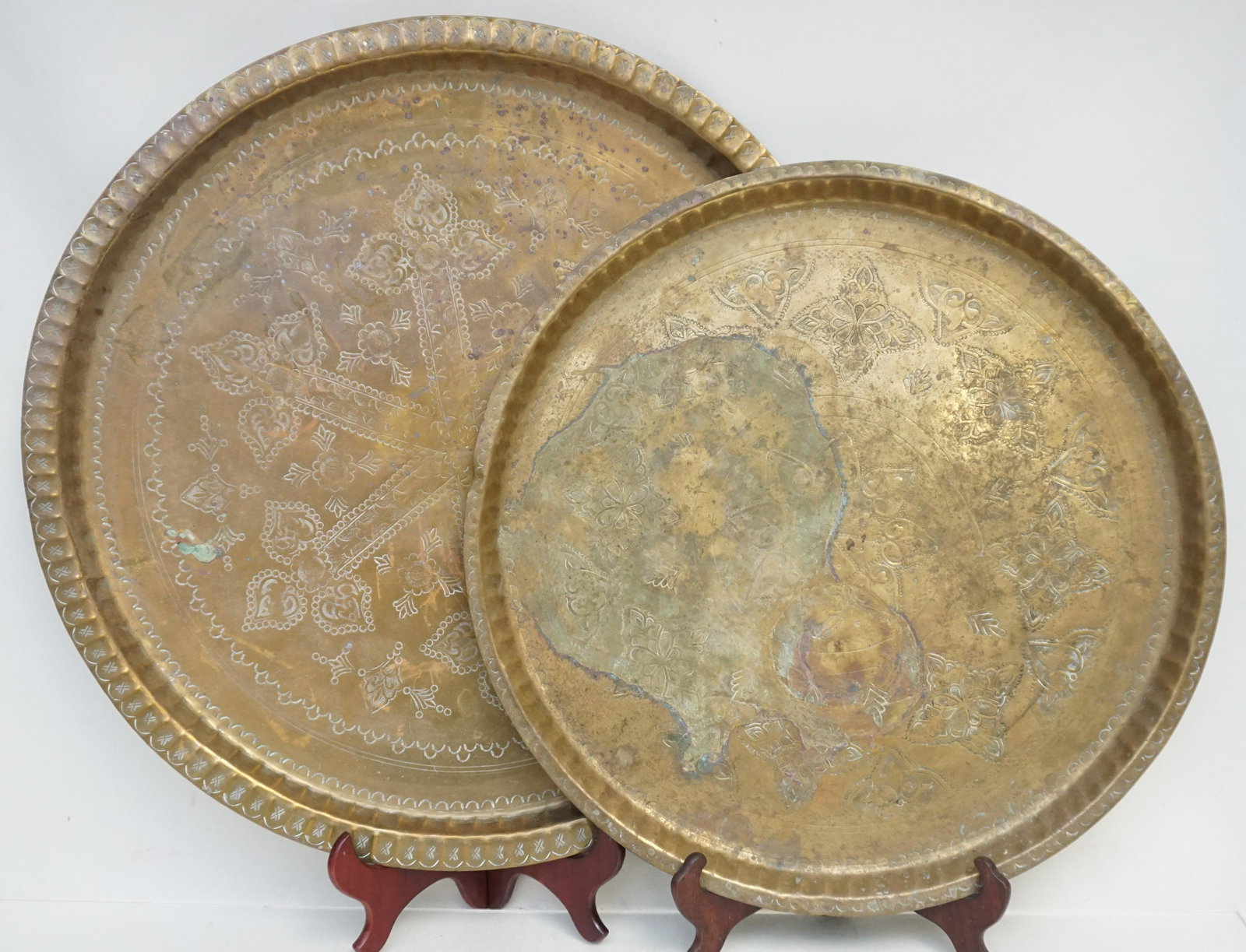 2 LARGE MOROCCAN BRASS TRAYS: Two Large Vintage Hand Hammered and Hand Etched Brass Trays from Morocco. Largest 22 3/4". Smaller 19". Weight 8 pds 12 oz. PROVENANCE: A Private Charleston SC Estate.