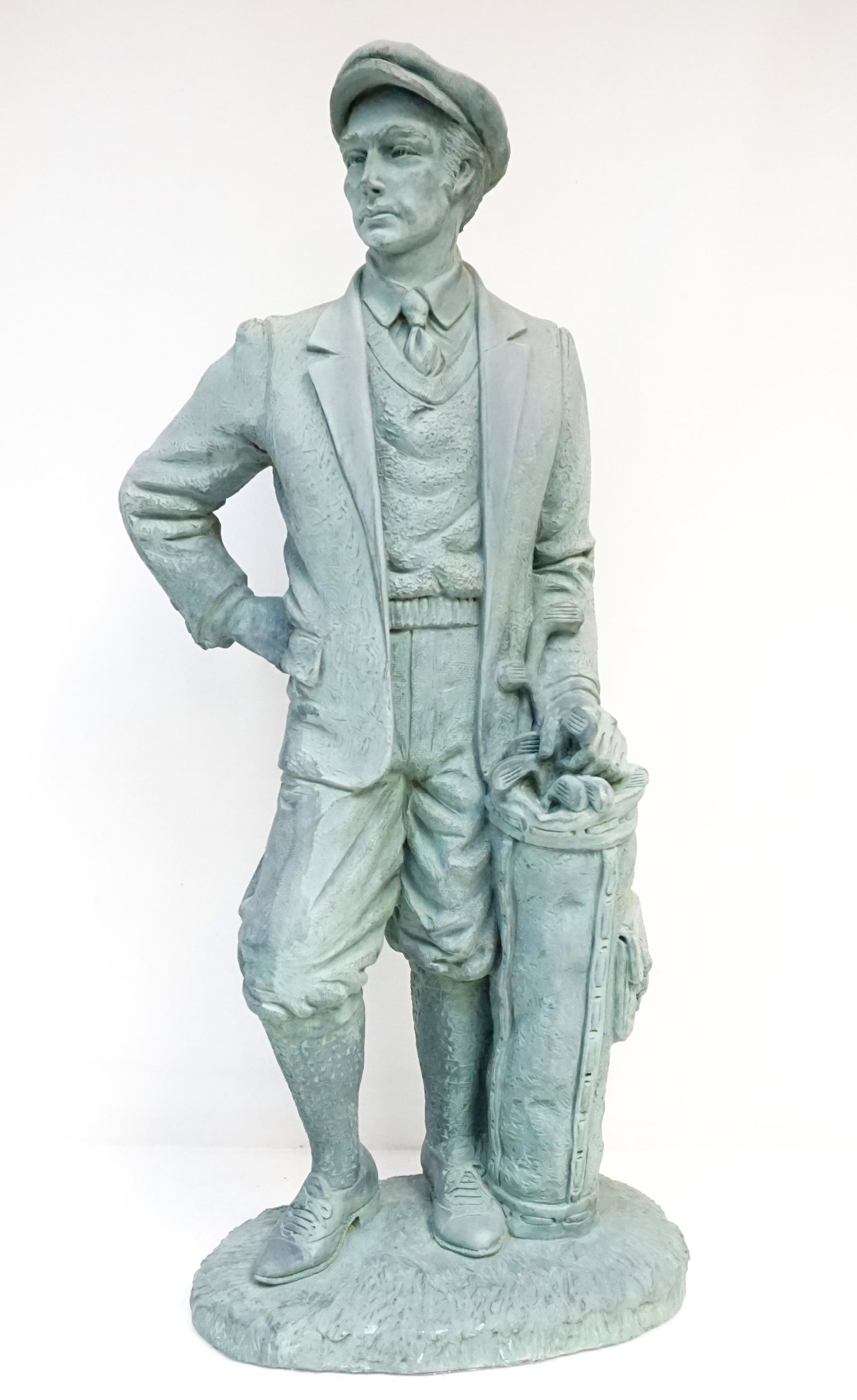 ROMO AUSTIN GOLFER SCULPTURE: 26'' T S Romo Austin Golfer Sculpture 1995. Made of Polystone painted with a green patina. Weight 13 pds. PROVENANCE: A Private Charleston SC Estate ***Pickup only or Shipping on this item offered thr