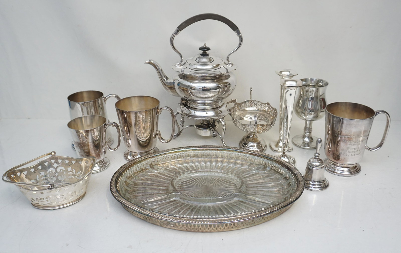12 pc SILVERPLATE & PEWTER: 11 Piece Vintage Silverplate and 1 Pewter Trophy Goblet from E.L.G.A. outing. Includes a Teapot with warming stand and burner. a golf trophy Mug from 1969 Rossendale Gold Club, 3 more stein /mugs, 2 m