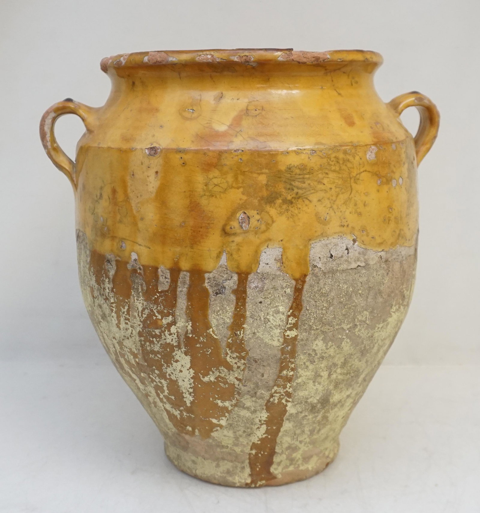 ANTIQUE FRENCH OLIVE JAR: Antique 19th c. French Pottery Confit / Olive Jar. Yellow. Has been drilled on the bottom. 12 1/4" tall. Weight 9 pds 11 oz. Chips to rim. ***Pickup only or Shipping on this item offered through Outwa