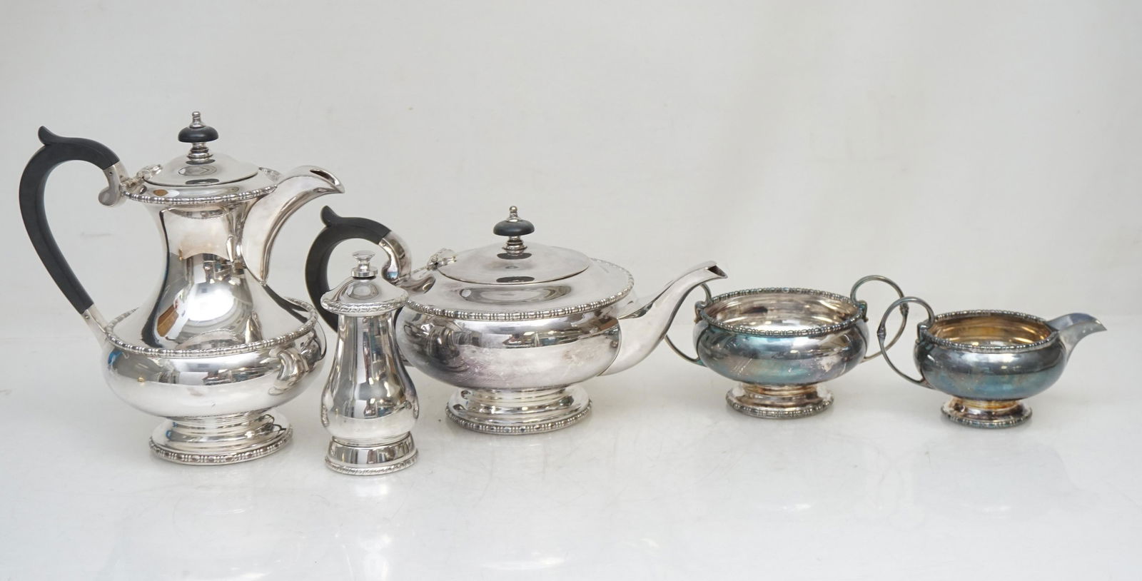ENGLISH WALKER HALL COFFEE SERVICE: Good Quality Vintage Walker & Hall Silver Plated Tea Set, England. Coffee Pot 8" tall, Teapot 5 1/2". Cream and Sugar. In addition there is a Silver Plated Pepper Grinder, maker unknown. Weight on all