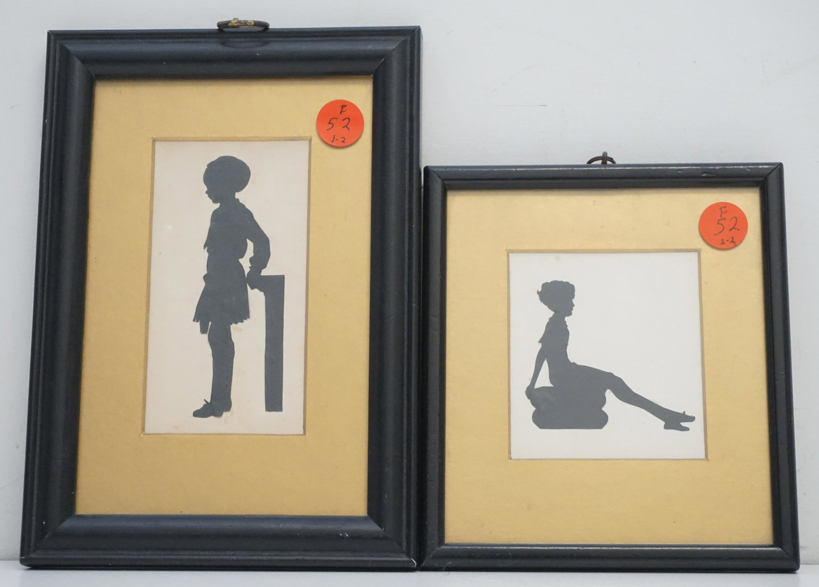 PAIR ANTIQUE ENGLISH SILHOUETTES: Pair of good quality Antique English Silhouettes c. 1900. Both feature Children, both with gold mats and black wood frames. Largest frame 8 1/2"x6". Smaller 5 1/2"x6 1/4". Weight 1 pd. PROVENANCE: A C