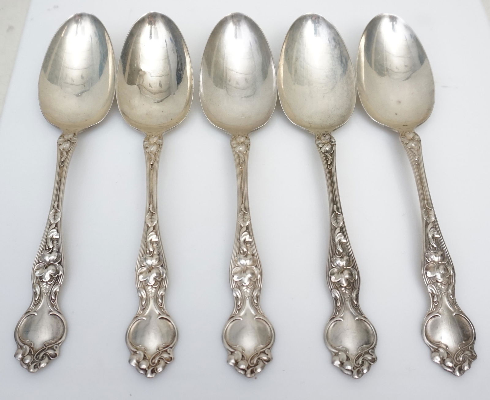 5 1902 STERLING VIOLET SERVING SPOONS: Five Sterling Silver Serving Spoons by Wallace Silversmiths c. 1902. No monograms. Each 8 1/4". Weight 230 grams. PROVENANCE: A Charleston SC Private Estate