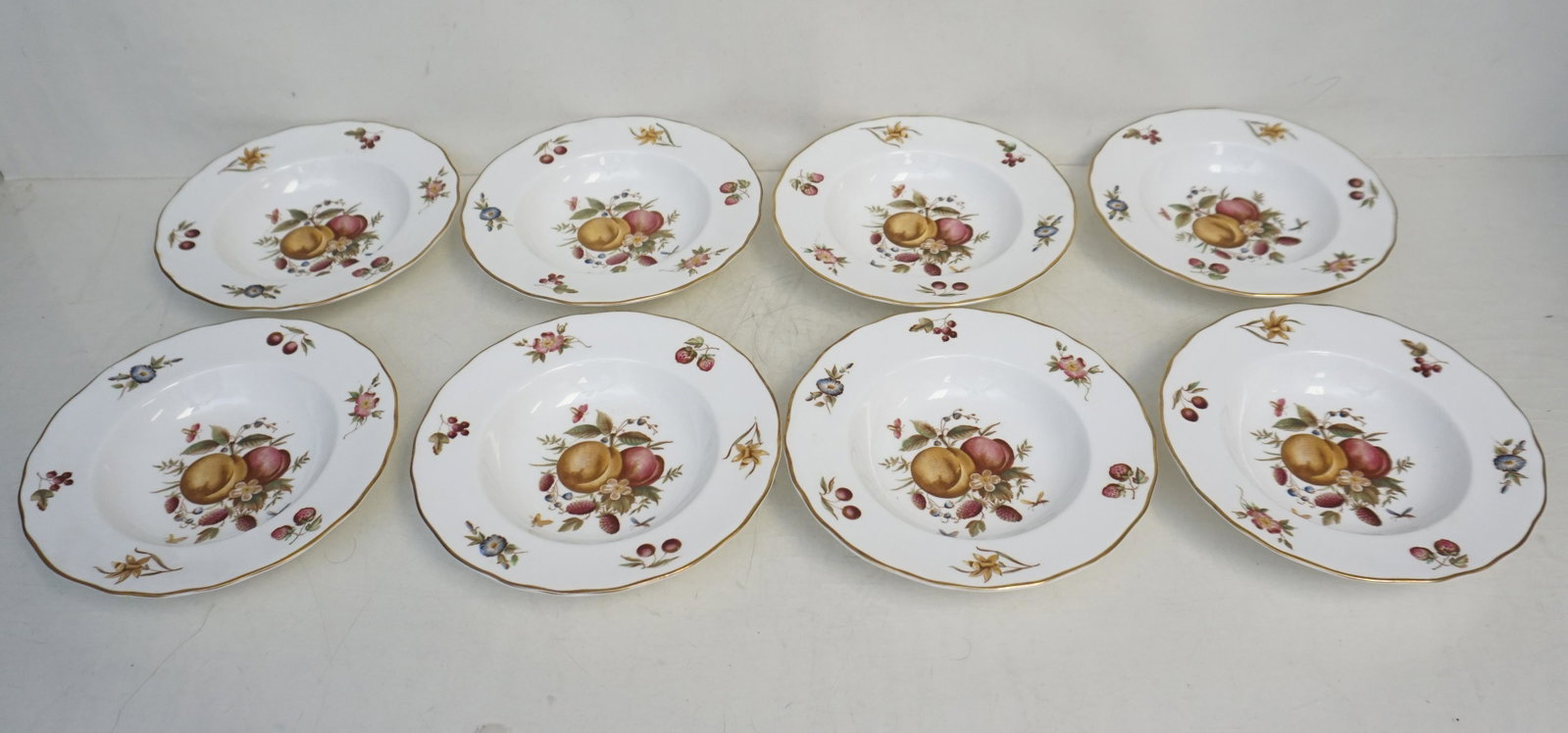 8 ROYAL WORCESTER DELECTA SOUPS: Eight Royal Worcester Delecta Rim Soup Bowls. Fruits and insects, each measuring 8". Weight 6 pds, 7 oz. . PROVENANCE: A Charleston SC Private Estate.