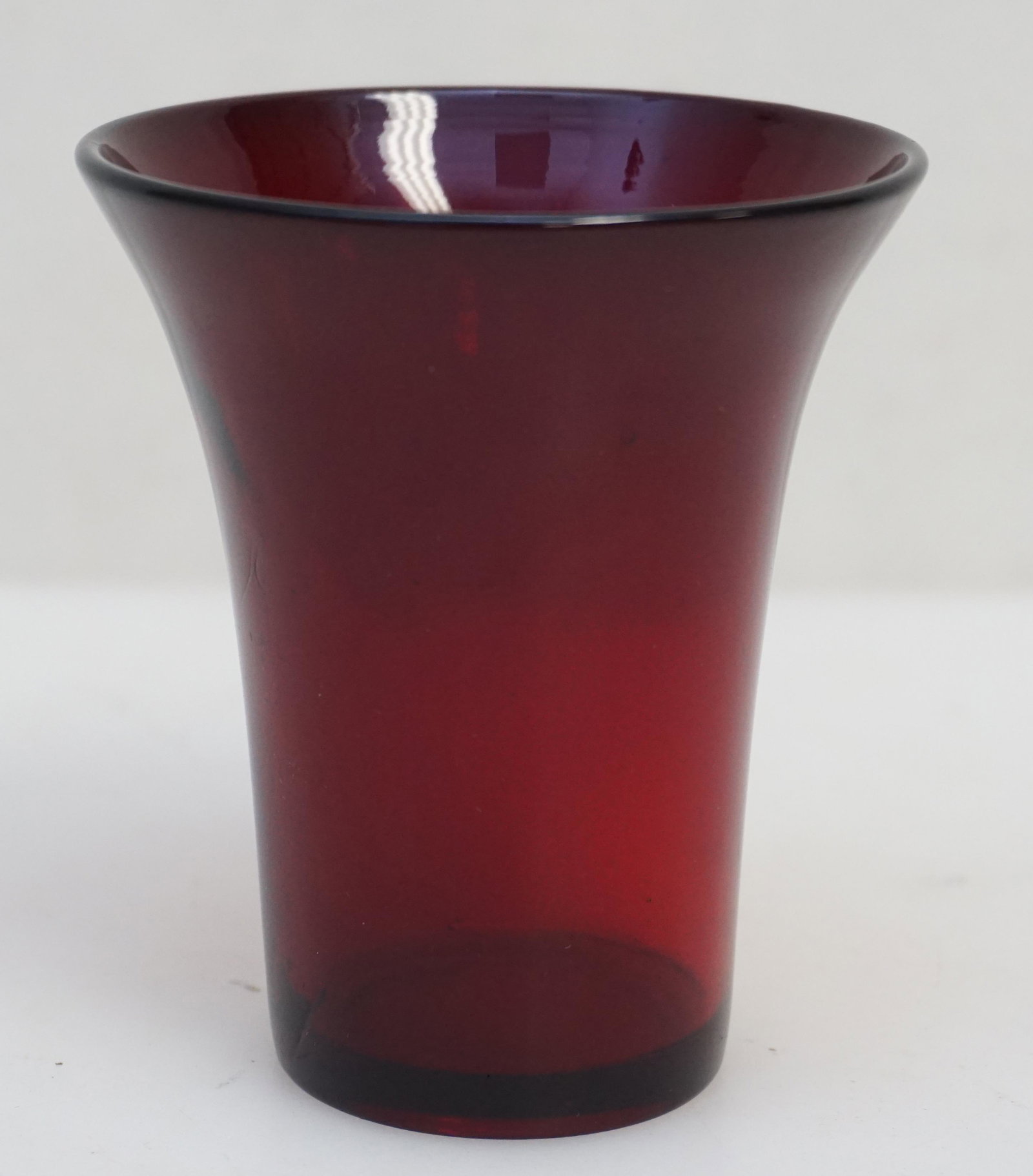 RUBY PEKING GLASS WINE CUP: Qing Dynasty, late 18th/early 19th century peking Glass Wine Cup. Translucent ruby red example, highly polished, everted flare lip 3 3/4". Weight 5.3 oz. PROVENANCE: A Private Charleston SC Estate