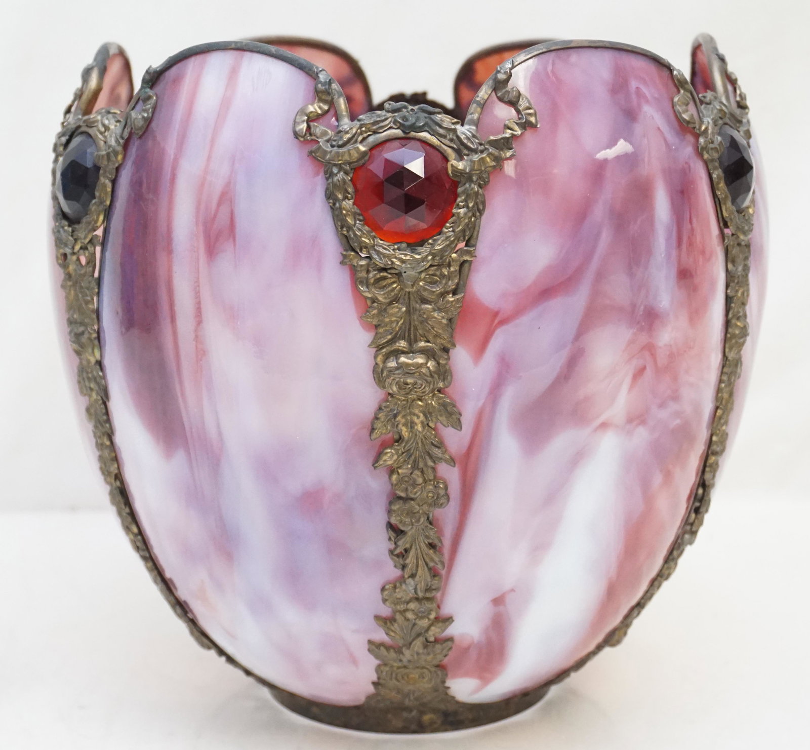 SLAG GLASS JEWELED TULIP SHADE: Antique Cranberry Slag Glass Tulip Shade with Ruby Jewels. Frame is a ornate floral and swag. Measures 9"x9"x9". Weight 3 pds 2 oz. PROVENANCE: A Private Charleston SC Estate.