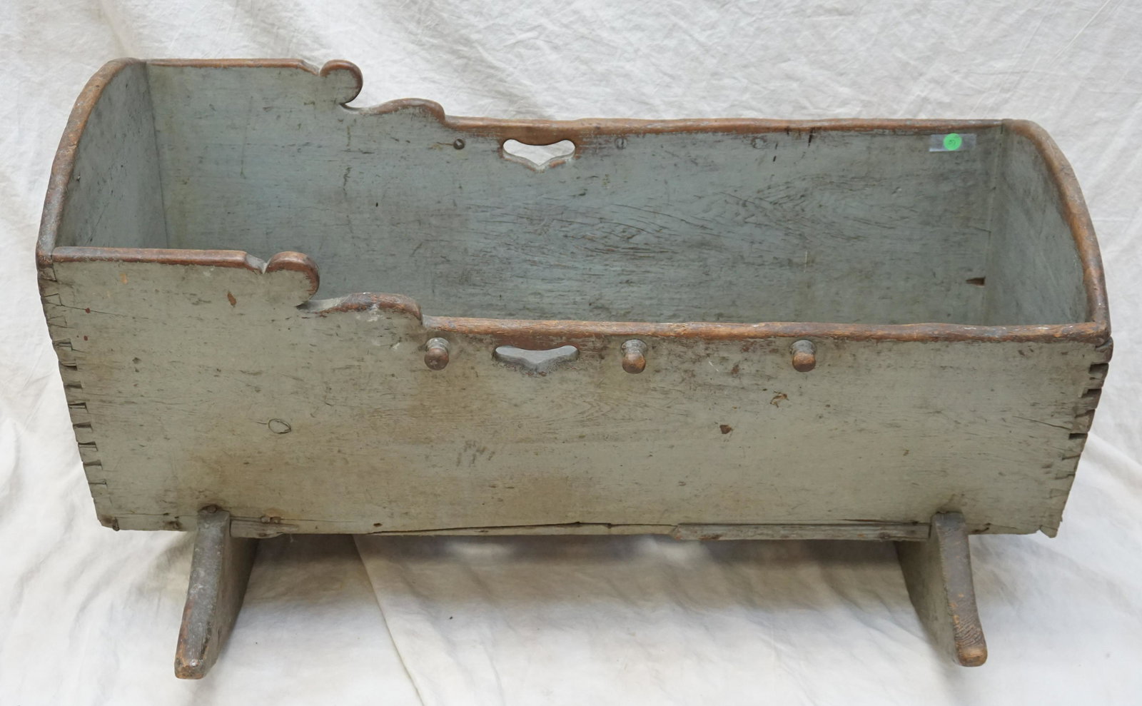 ANTIQUE AMERICAN PRIMITIVE BABY CRADLE: Antique American Primitive Cradle c. 1840, Pennsylvania. Original old blue oyster paint. Cradle measures 38 1/2"x17"x19". Rockers each 25". PROVENANCE: A Private Charleston SC Estate. ***Pickup only o