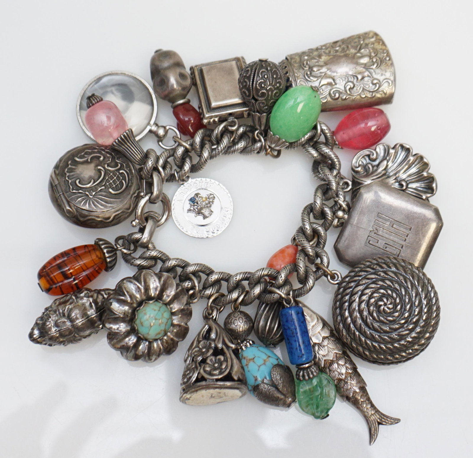 1950s NAPIER CHARM BRACELET: Vintage 1950s Napier charm bracelet having 21 mostly large charms, one German charm marked "800" and two charms marked "Sterling" including one enameled and engraved hinged locket charm with picture o