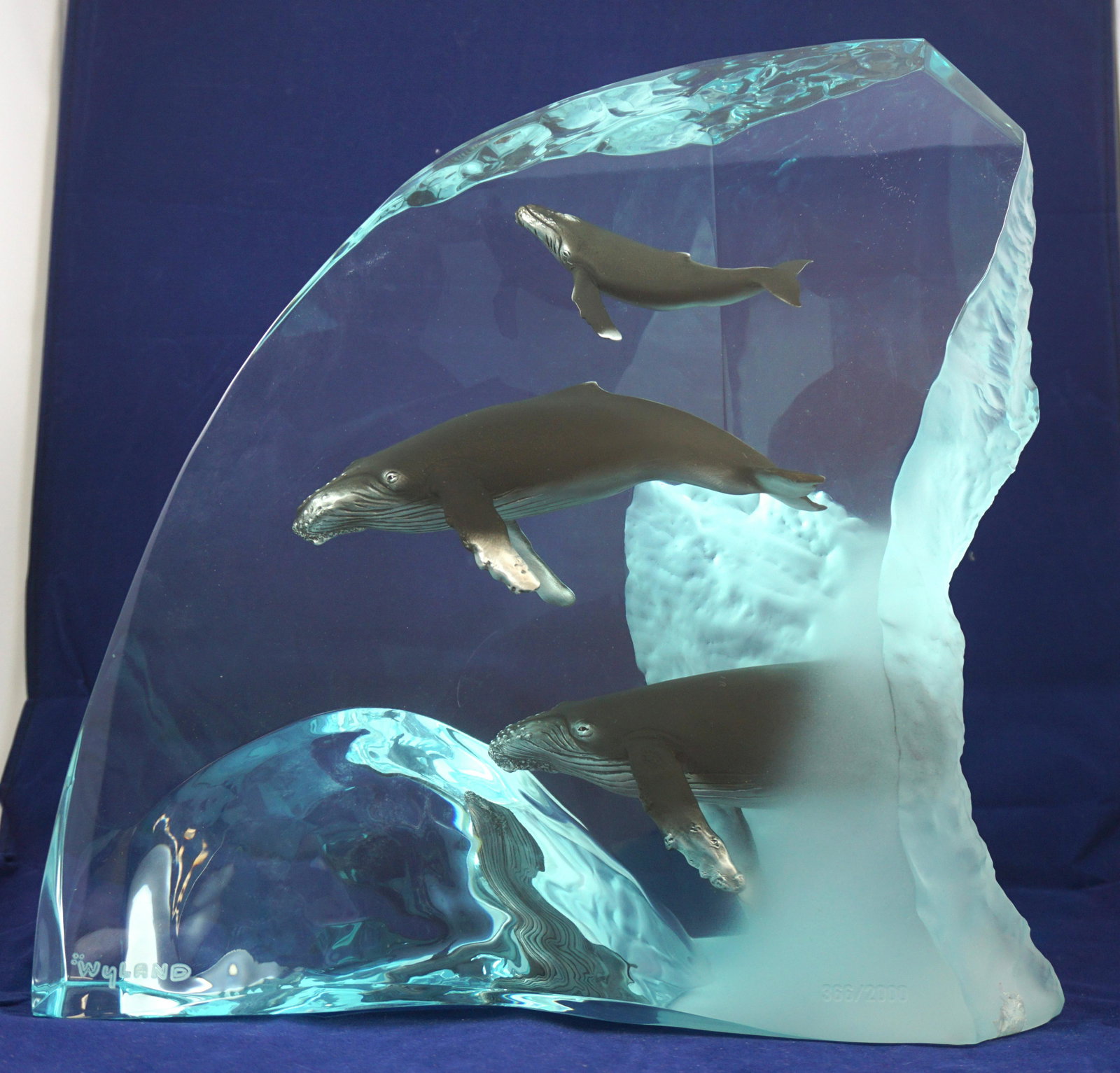 WYLAND HUMPBACK WHALE LUCITE SCULPTURE: Robert Wyland (American, b. 1956) Humpback Whale Family Blue lucite sculpture. Signed lower left. Marked lower right "366/2000". Weight 22 pds. PROVENANCE: A Private Charleston SC Estate. ***Pickup on
