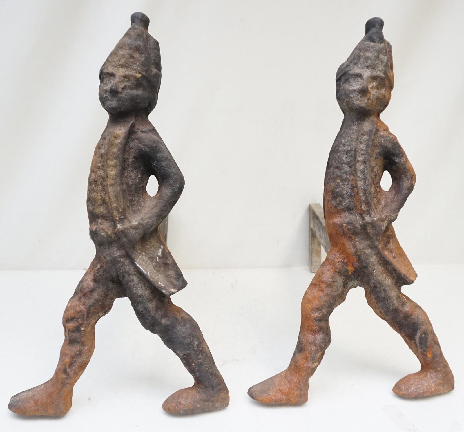 ANTIQUE HESSIAN SOLDIER ANDIRONS: Pair of Antique Hessian Soldier Andirons. Wear and rust. Each 16"x16". Weight 27 pds. PROVENANCE: A Private Charleston SC Estate.