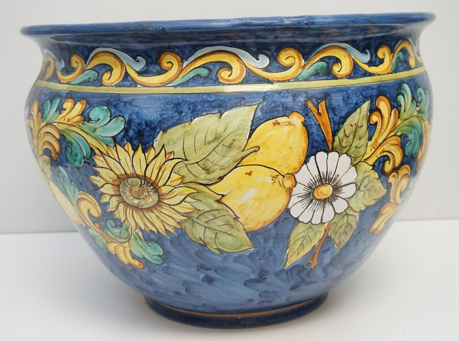 LARGE VIETRI ITALIAN MAJOLICA JARDINIERE: Very large Majolica Italian Vietri hand painted Planter / Jardiniere. Lemons, Sunflowers and Daisies on Cobalt Blue. Measures 20"x20"x15". Weight approximately 28 pds. PROVENANCE: Gippy Plantation, Be