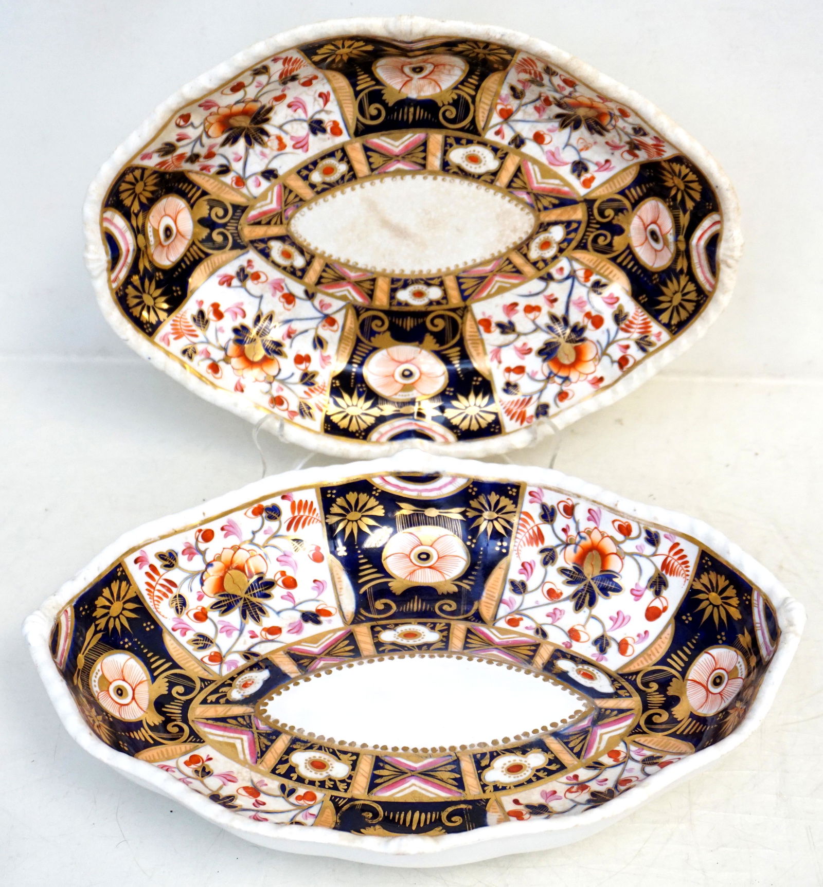 PAIR 1820 DERBY IMARI BOWLS: Pair of Antique c. 1820 English Derby Imari Oval Bowls. Painted mark with Crown above crossed batons and D below used 1806-1825. Wear to one. Each 8 1/2"x11 1/2"x2". Weight 3 pds. PROVENANCE: Gippy Pl