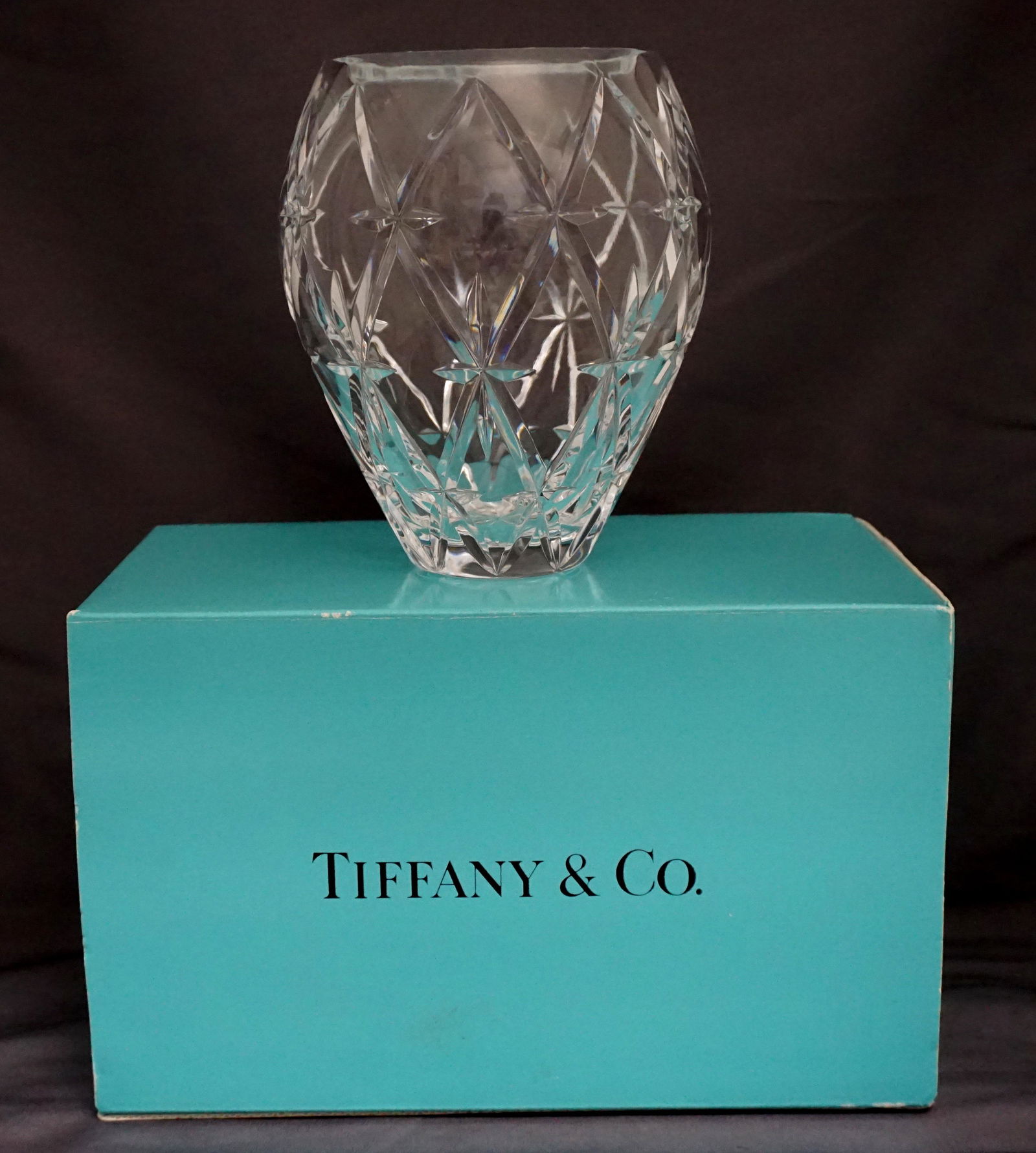 TIFFANY & CO CRYSTAL VASE: Tiffany Cut Crystal Vase. With acid etched hallmark on base. In the Original Tiffany blue box. Like new. Vase 6 1/4 tall". In box 10"x6 1/4"x6". Weight 2 pds 13 oz. PROVENANCE: A Private Charleston SC