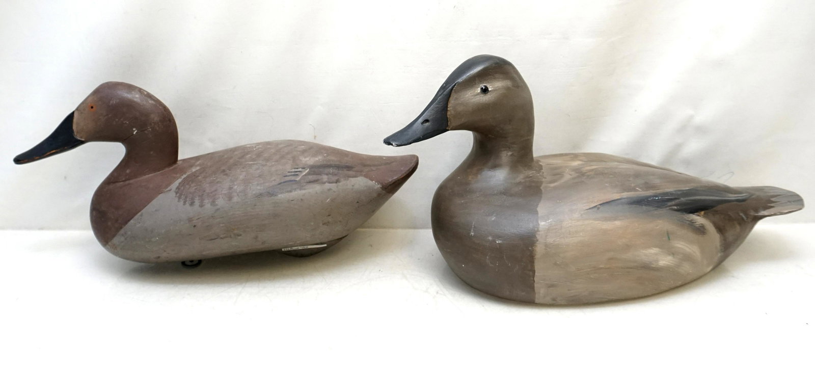 2 WORKING DECOYS VINTAGE: 1- Wooden working decoy with glass eyes circa 20th century, marked WRG to bottom, by William Goenne of King City, Ca., original paint 16 1/2". 2- Madison Mitchell Wooden working decoy, crack to neck, 