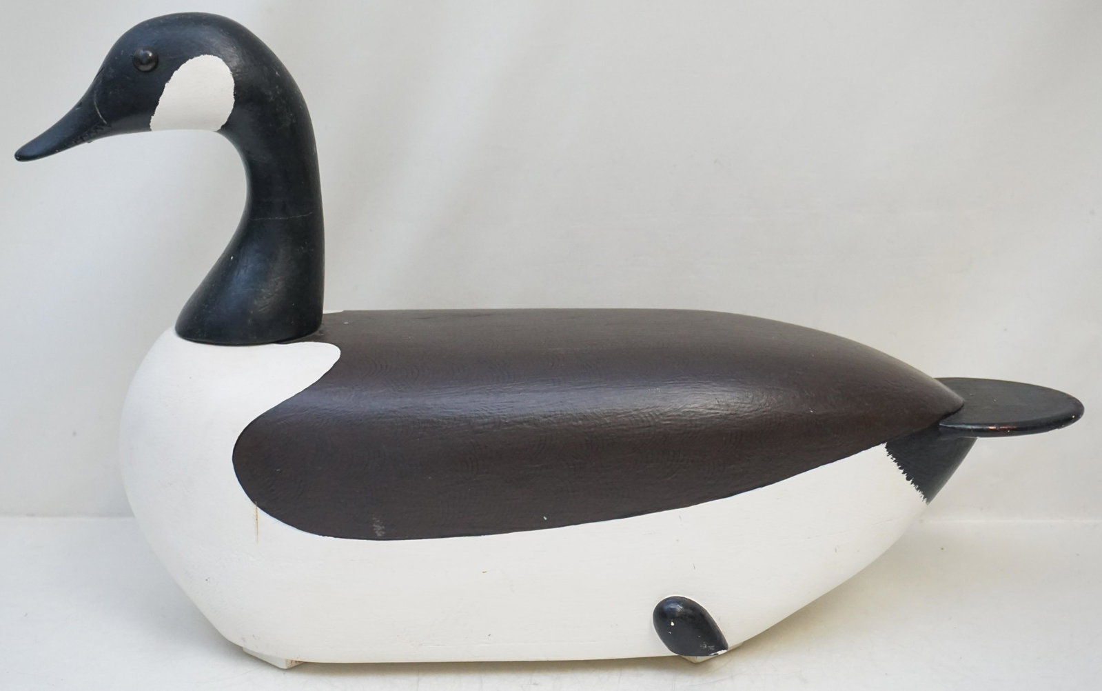 CANADIAN GOOSE DECOY: 20th c. Large Decorative Wood Canadian Goose Decoy with Glass Eyes. Measures 24"x7"x13 1/2". Weight 6 pds 6 oz. PROVENANCE: A Private Charleston SC Estate.