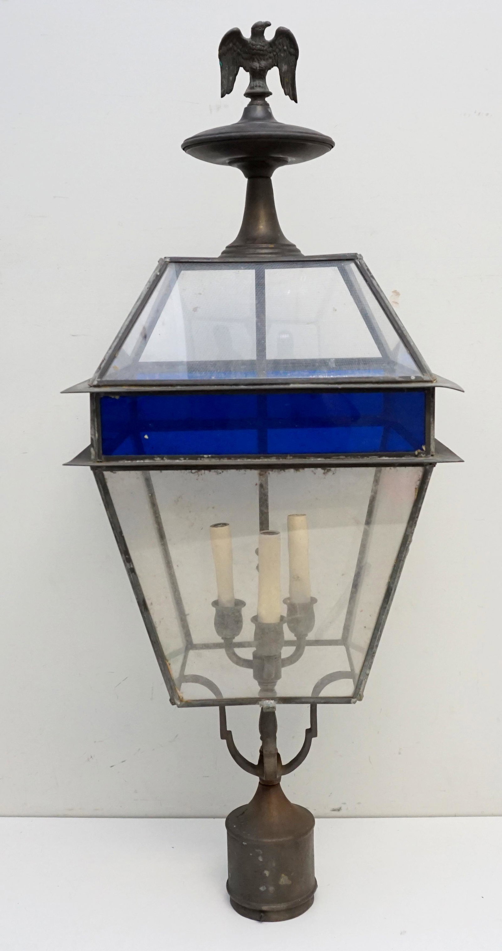 VINTAGE LAMP POST TOP: Vintage Outdoor Lamp Post Top, including wiring. Leaded Glass with Eagle Finial. 3 Light. Measures 13"x13"x33". Weight 13 pds. May need rewiring, PROVENANCE: A Private Charleston SC Estate.**Pickup on
