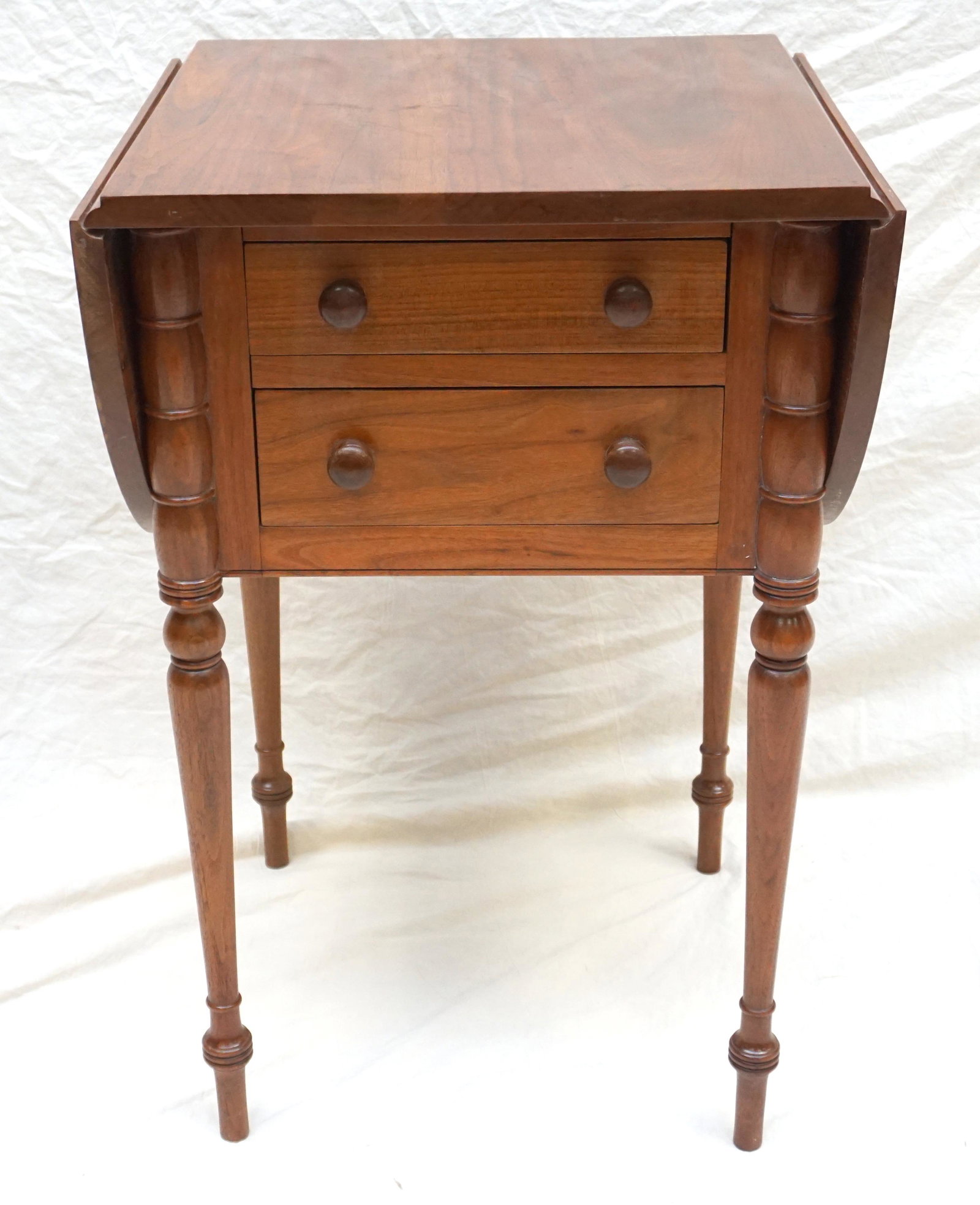 TWO DRAWER DROP LEAF WORK TABLE: Vintage Two Drawer Drop Leaf Work Table. Measures 19"x19"x30" 11" each leaf. ***Pickup only or Shipping on this item offered through Outward Bound 413-854-3676, Laney’s Ship & Haul 256-770-5750, Pak