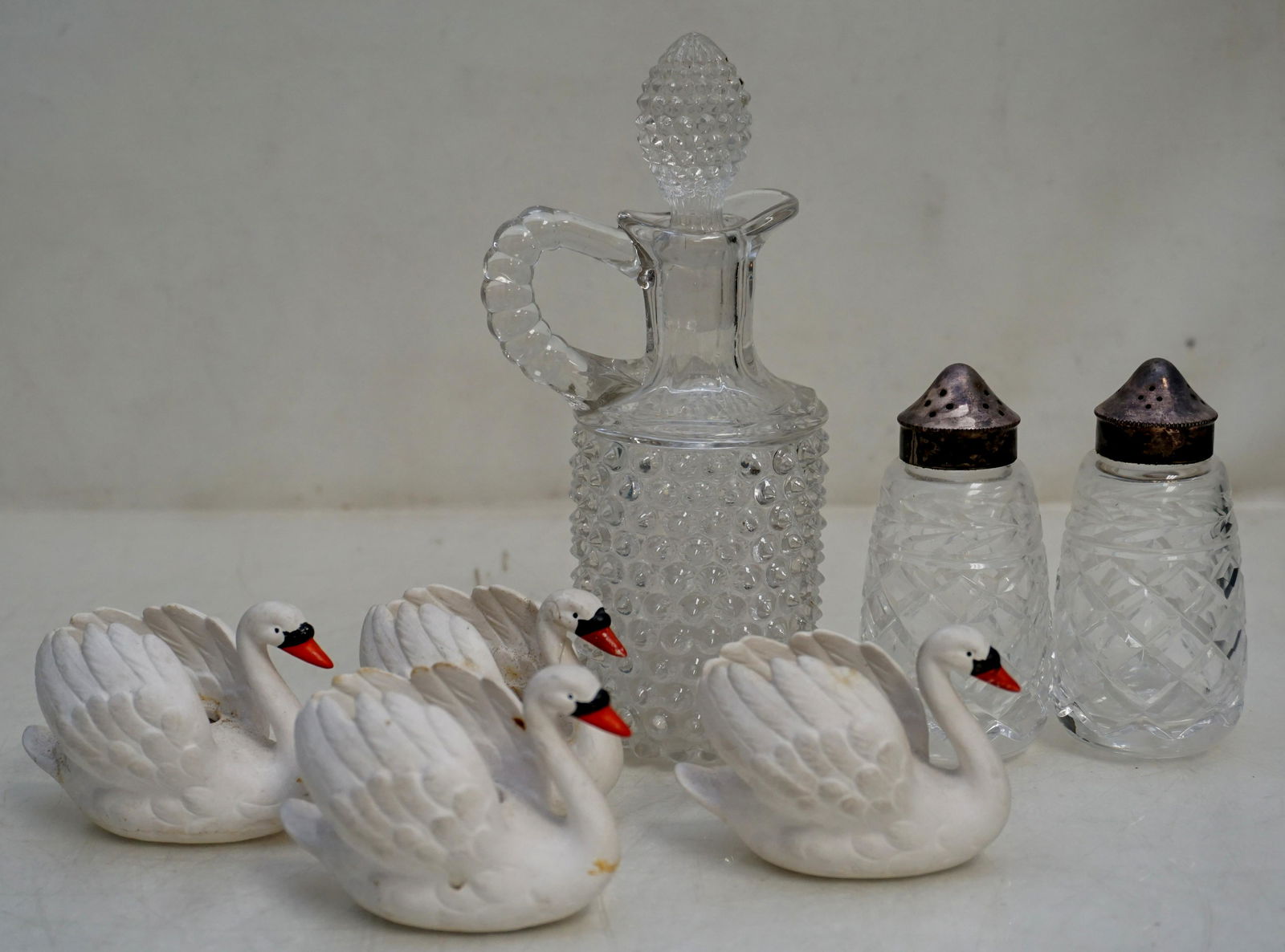 LOT GOEBEL SWANS & EAPG: 1- 4 Small Goebel porcelain bisque ZV/103/0 Swan planter/bowl made in Germany. Total length about 2.75". 1 neck glued. 2- EAPG Salt and Pepper Shakers, each 3 1/2" tall. 3- 19th c EAPG Mold Blown Patt