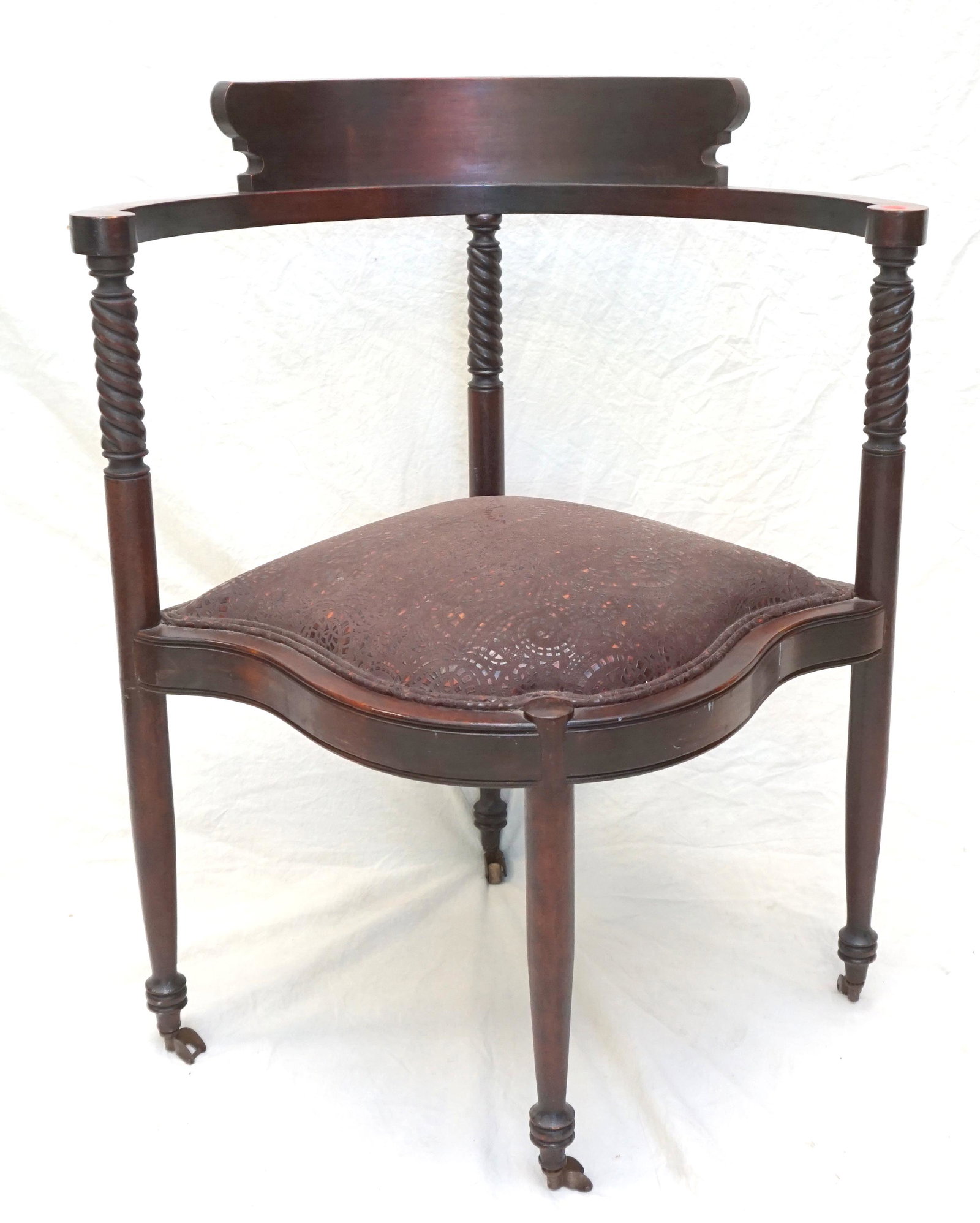 ANTIQUE LEATHER CORNER CHAIR: Antique Corner Chair c. 1910 with barley Twist Stiles. Textured Leather Upholstered Seat. Measures 45"x21"31". PROVENANCE: A Private Charleston SC Estate. ***Pickup only or Shipping on this item offer