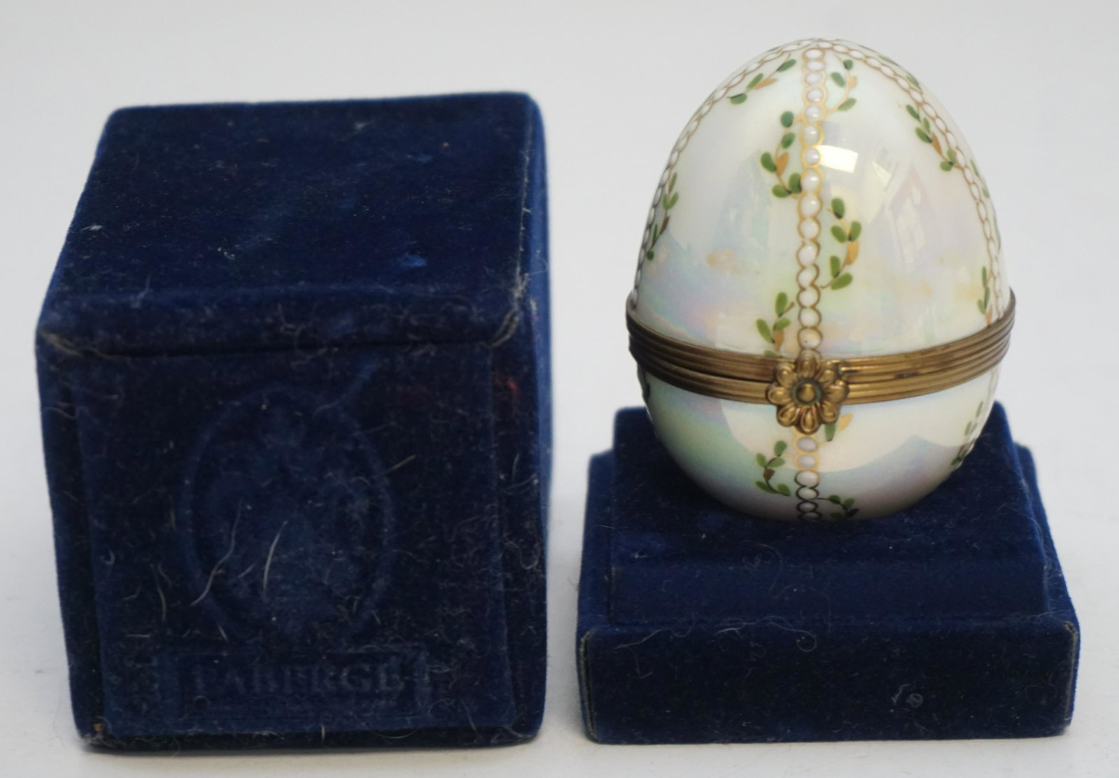 IMPERIAL FABERGE LIMOGE PORCELAIN EGG: Imperial Faberge Limoge Porcelain Egg. Pearlescent Luster. In original presentation box. Egg 2 1/4. Box 2 1/4"x2 1/4"x 3 3/4". Weight 5 oz. PROVENANCE: A Private Charleston SC Estate