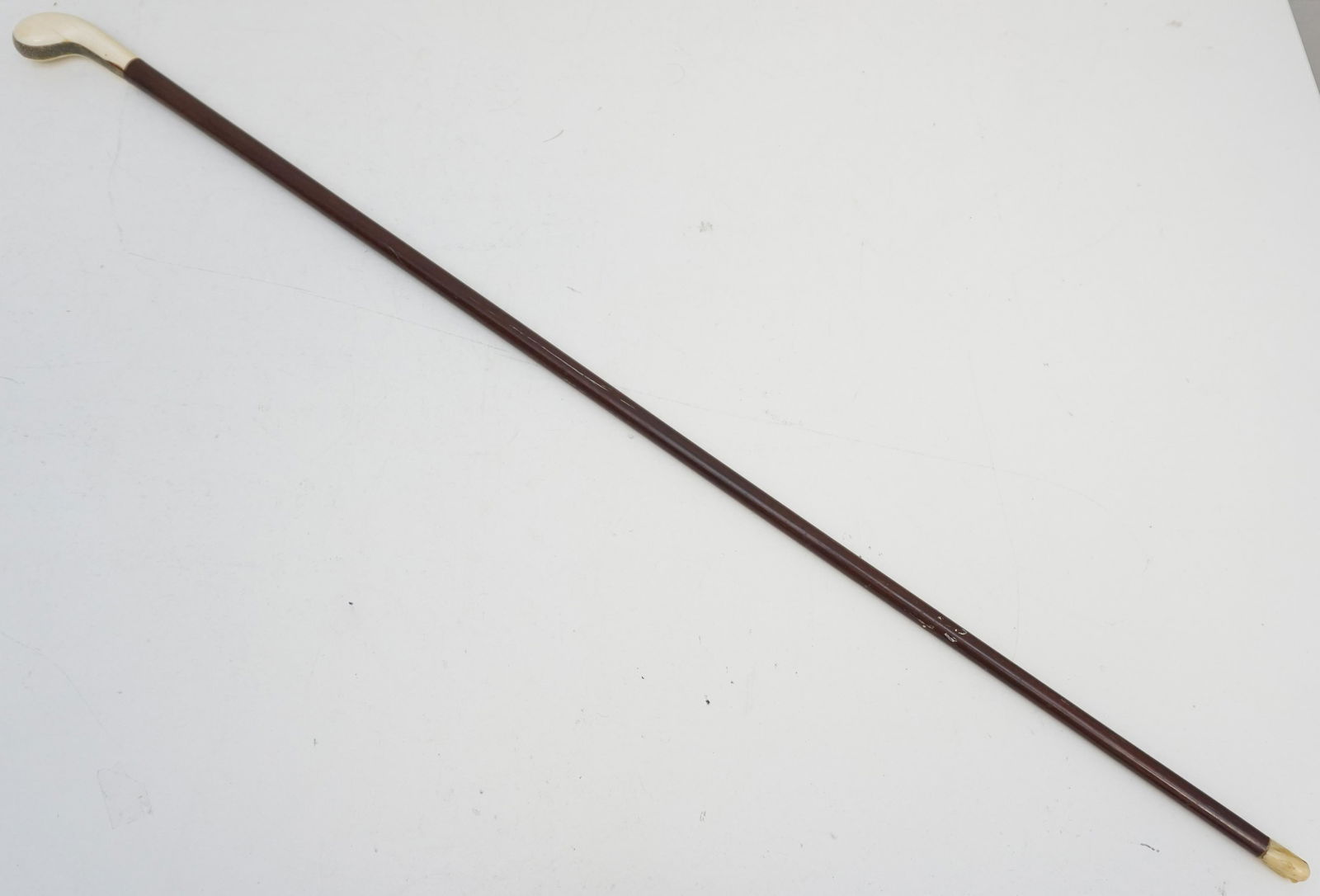 ART DECO WALKING STICK BONE + SILVER: Art Deco Walking Stick with Bone Handle and Tip. Top with silver shagreen accent. Measures 35 1/2". Weight 12 oz. PROVENANCE: A Private Charleston SC Estate.