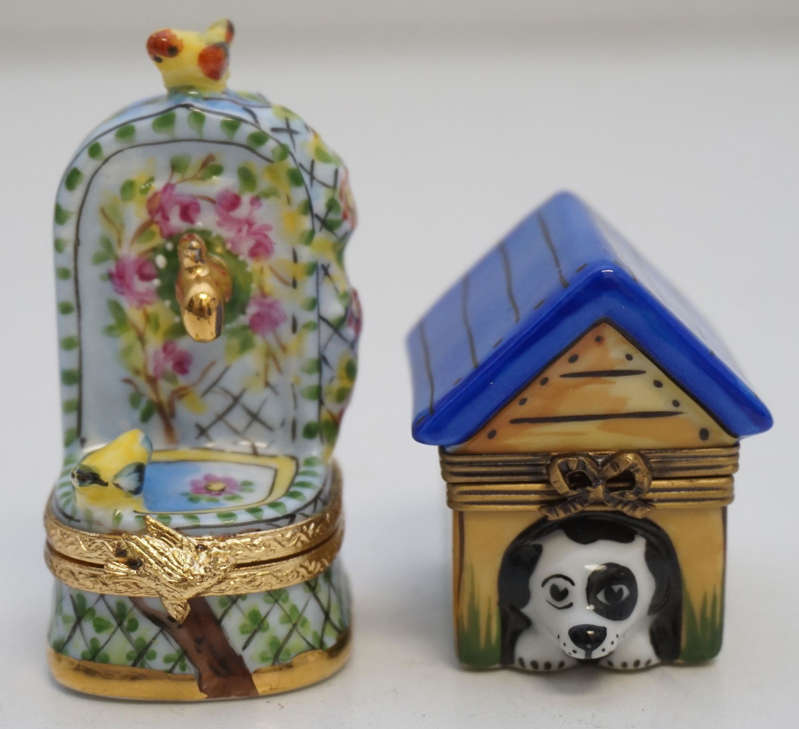2 LIMOGES PEINT MAIN BOXES: Two Limoges France Peint Main Boxes. Doghouse that opens to reveal painted dog body 1 3/4". Fountain with Birds 2 1/4". Weight 3 oz. Good condition. PROVENANCE: A Private Charleston SC Estate