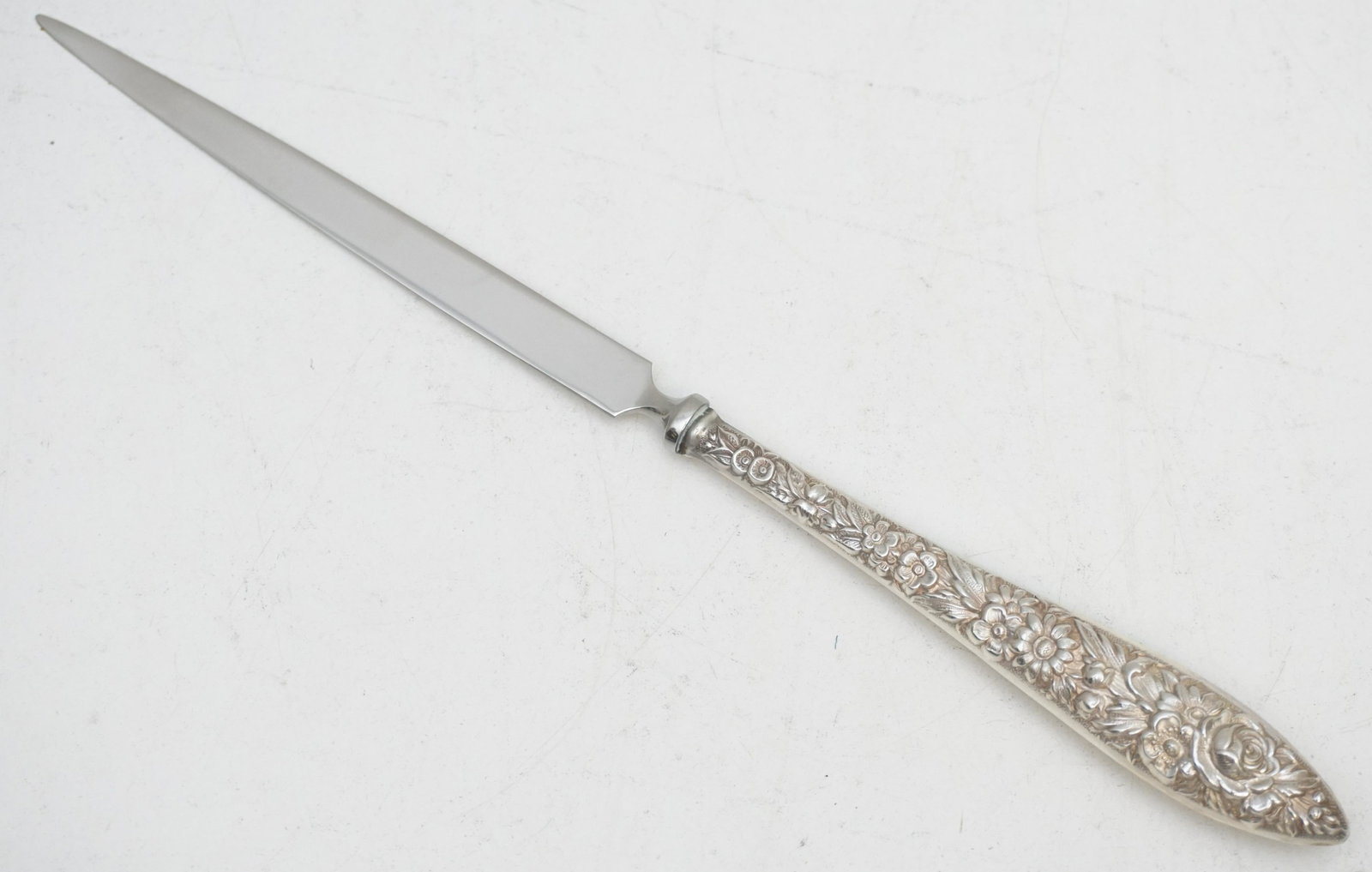 KIRK STIEFF STERLING REPOUSSE LETTER OPENER: Kirk Stieff Repousse Large Letter Opener with Stainless Blade. 9 1/4". Excellent condition. PROVENANCE: Edwin Moore Brogdon, PhD, collection. Dr. Brogdon was the owner of Brogdon Manor, a stately plan