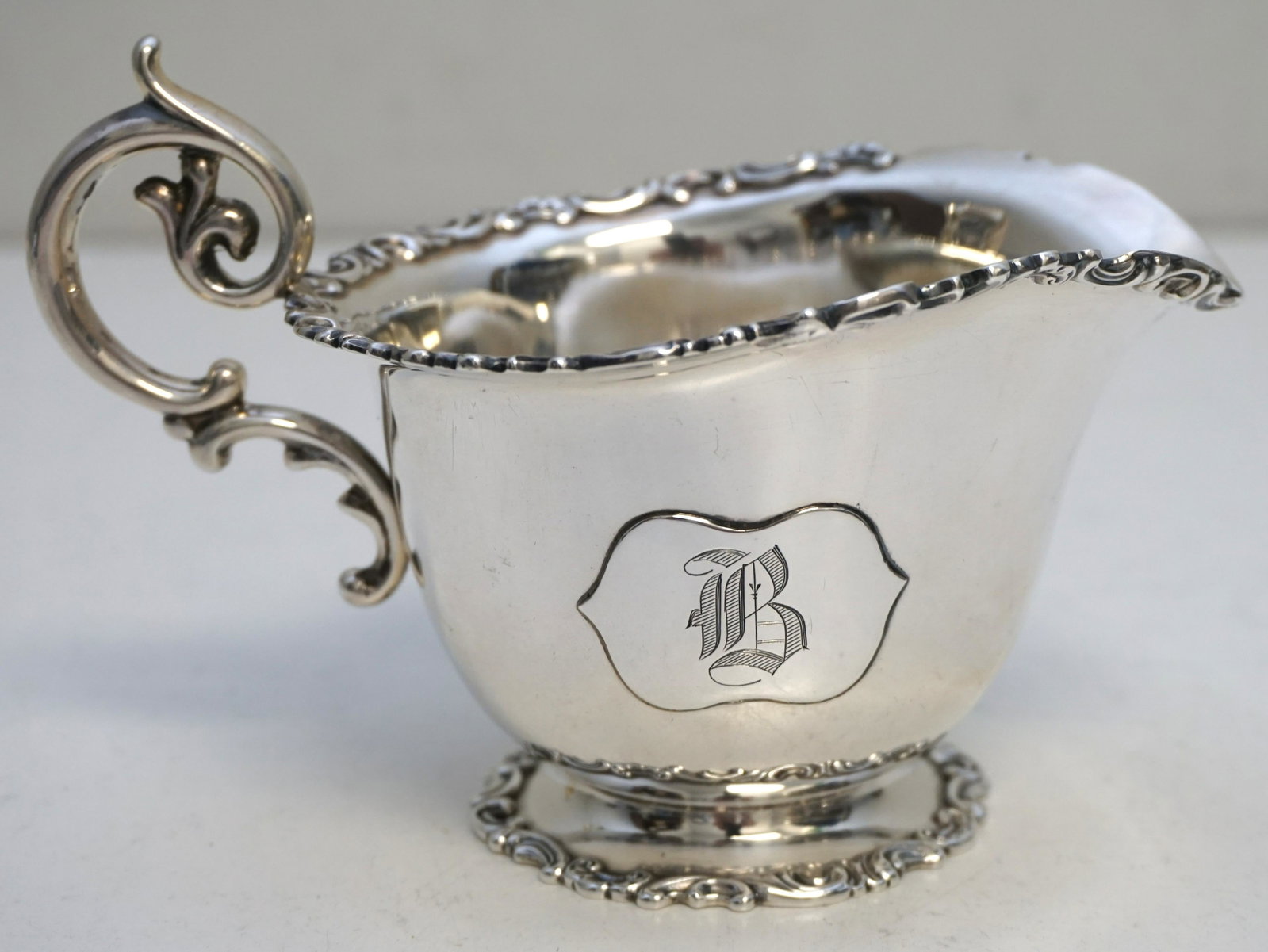 GORHAM 19TH c STERLING SAUCE BOAT: Gorham Sterling Silver 19th c. Sauce Boat. Monogrammed B. Measures 5 1/2"x4"x3 1/2". Weight approximately 150 grams. PROVENANCE: Edwin Moore Brogdon, PhD, collection. Dr. Brogdon was the owner of Brog