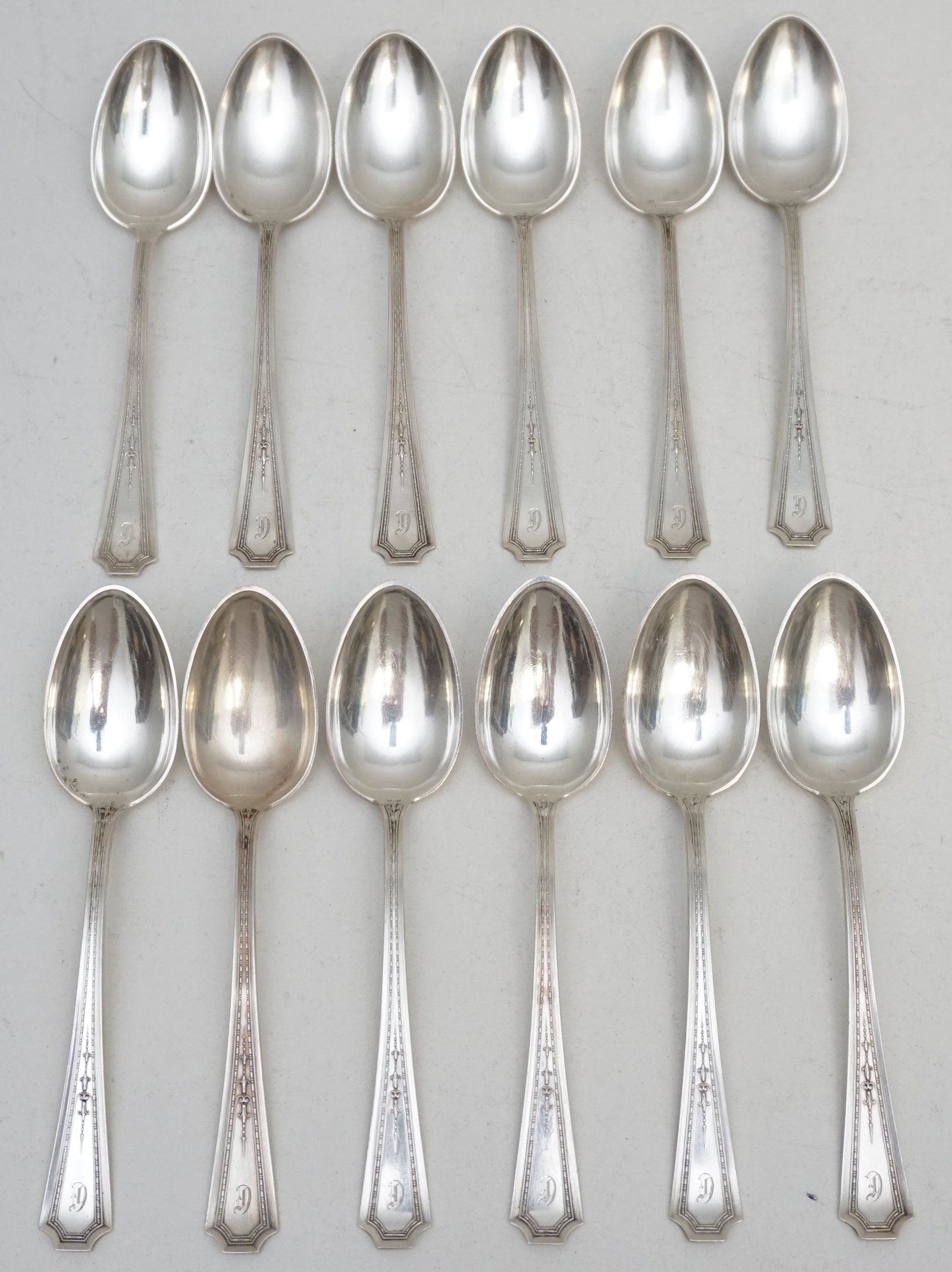 12 DURGIN STERLING SILVER COLFAX TEASPOONS: 12 Durgin 1922 Sterling Silver Teaspoons in the "Colfax:" pattern, The Colfax pattern, patented 1922 by the Durgin division of Gorham, designed by Frederick R. Roberts, is the decorated version of the