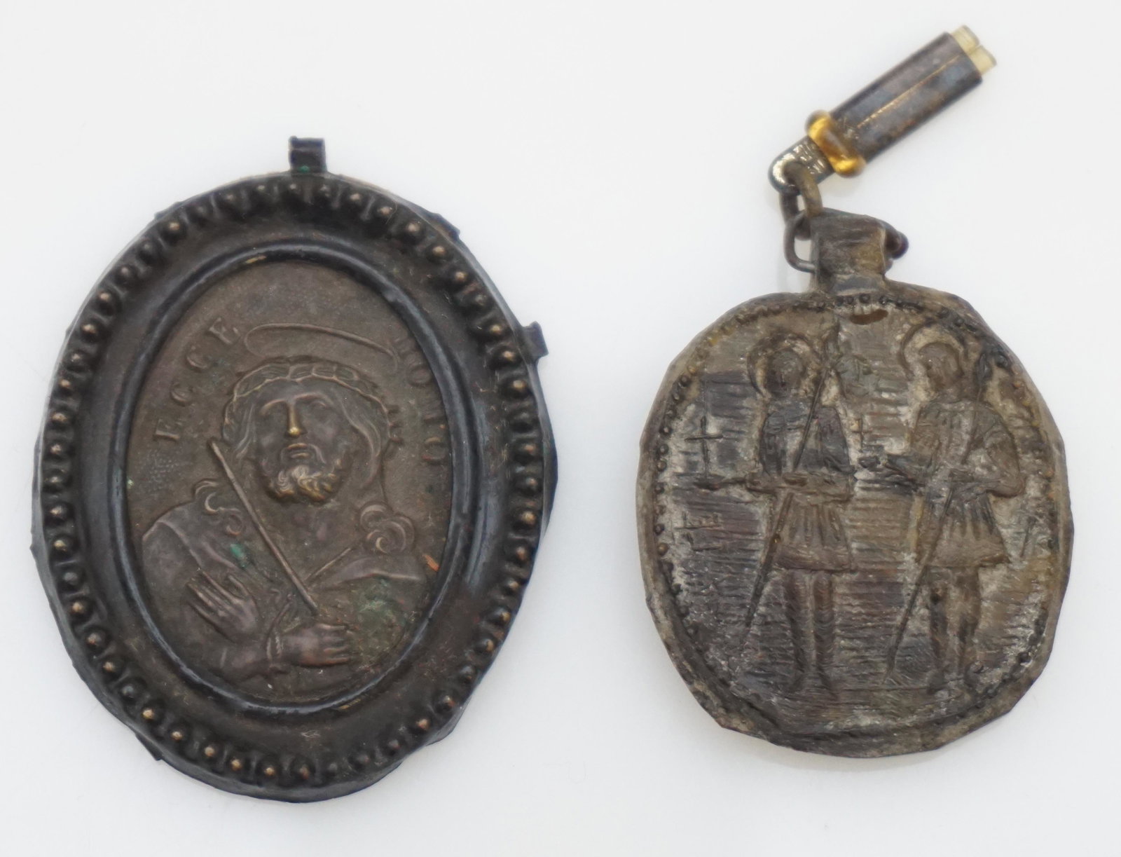 2 18th c. RELIGIOUS PENDANTS SPAIN: Pair of Antique 18th c. Religious Pendants from Spain. Bronze Ecce Homo 1/4" and The other maybe jet or gutta percha 1 3/4". PROVENANCE: A Private NYC/Charleston SC Estate..