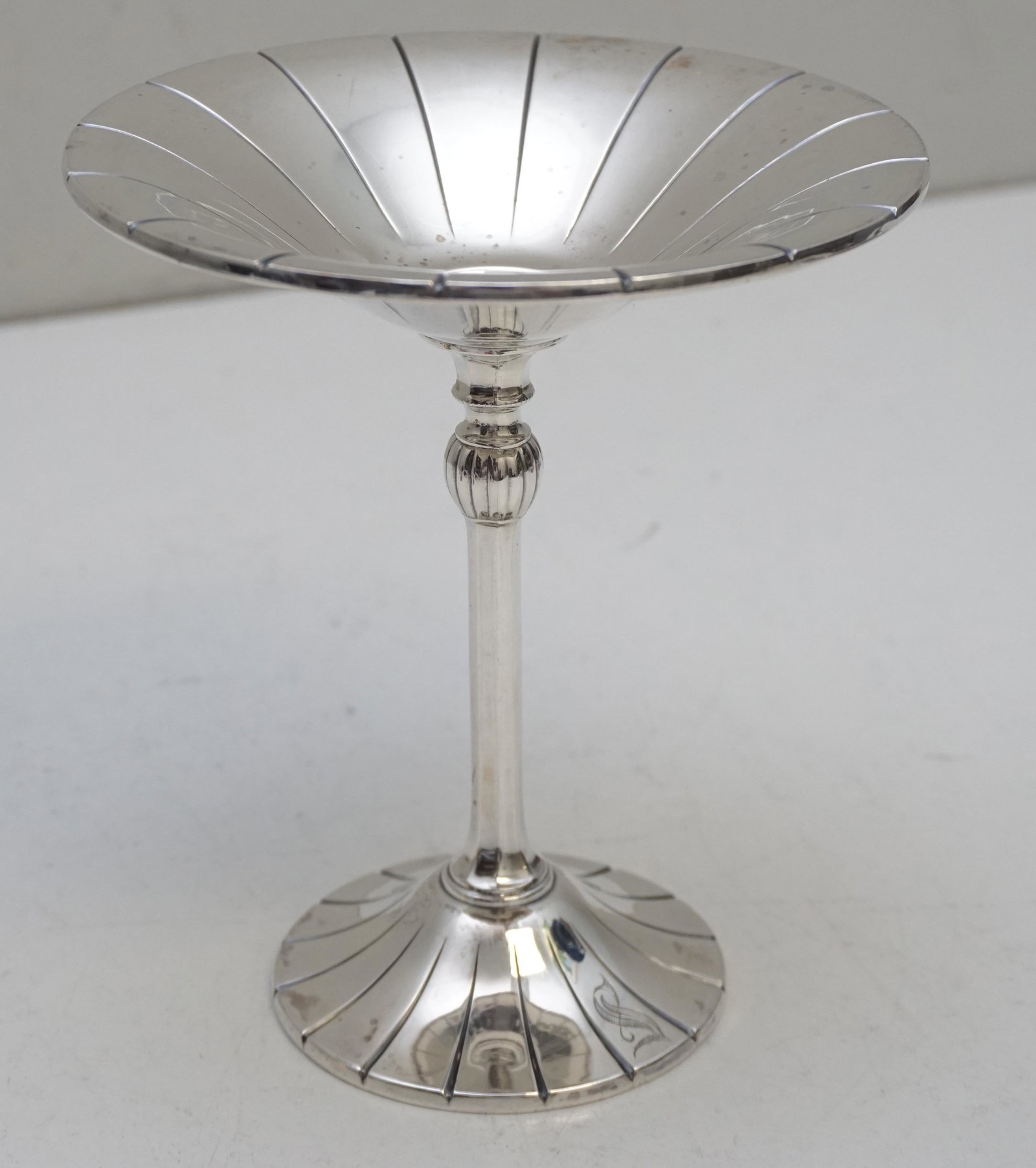AMERICAN STERLING SILVER COMPOTE: American Sterling Silver Tall Compote by International Silver. Fluted foot and bowl. Measures 5 1/2"x5 1/2"x6 1/4". Weight approximately 165 grams. PROVENANCE: Edwin Moore Brogdon, PhD, collection. Dr