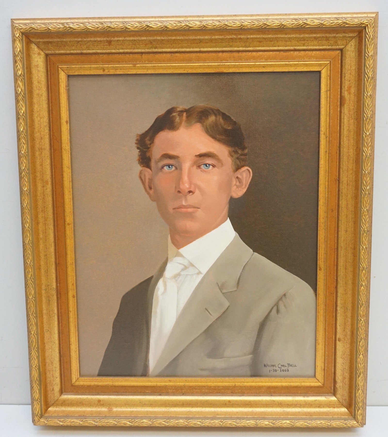 PORTRAIT by WILLIAM CARL BELL (1946-2013): Young Mans Portrait, Oil on Canvas by William Carl Bell (1946-2013). Painted in Blythewood, SC in 2003. In Gilt Wood Frame. Measures in frame 26 1/4"x22 1/2"x2 1/2". Portrait 20"x16". Weight 7 pds. Bo