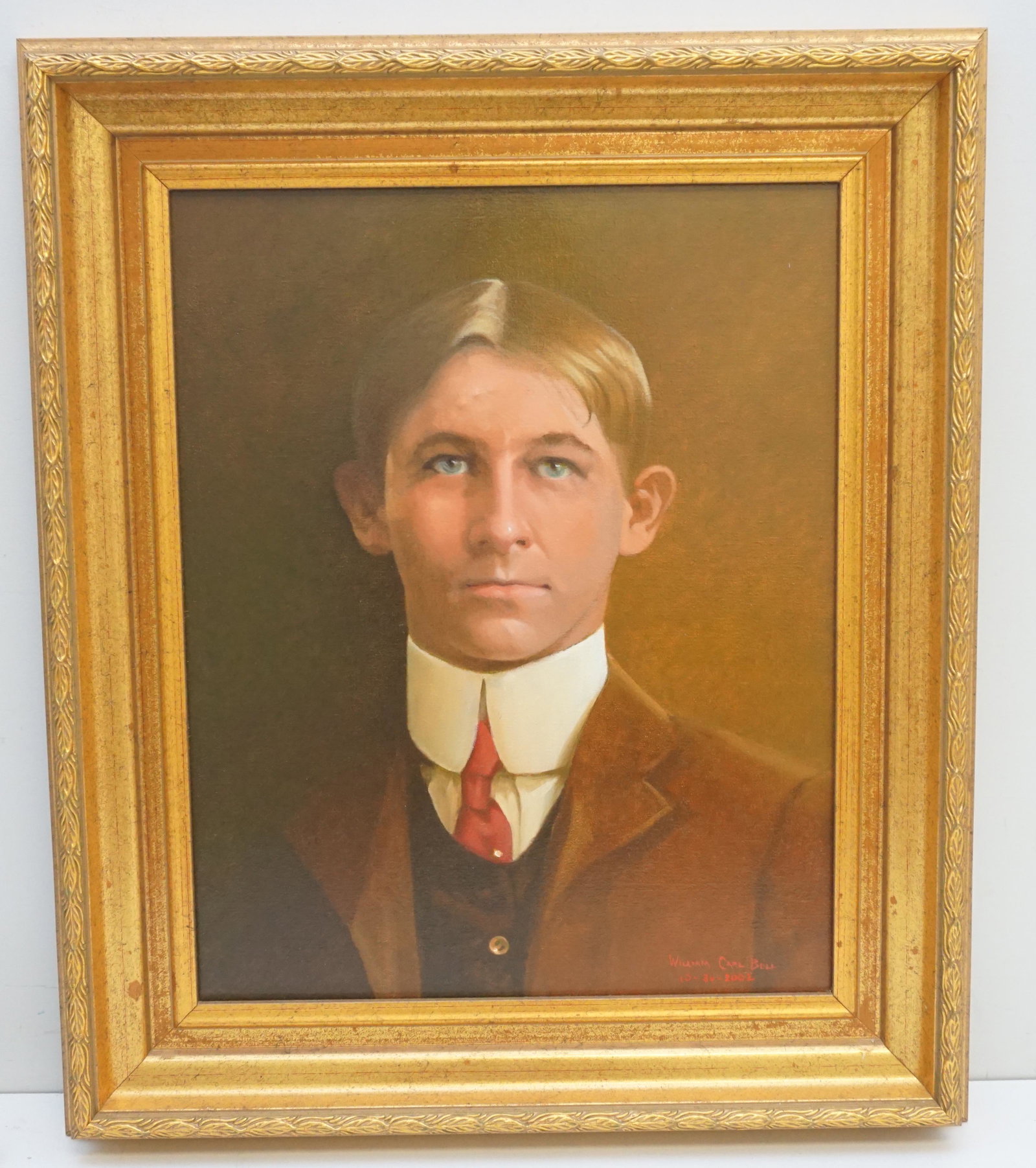 PORTRAIT by WILLIAM CARL BELL (1946-2013): Young Mans Portrait, Oil on Canvas by William Carl Bell (1946-2013). Painted in Blythewood, SC in 2002. In Gilt Wood Frame. Measures in frame 26 1/4"x22 1/2"x2 1/2". Portrait 20"x16". Weight 7 pds. Bo